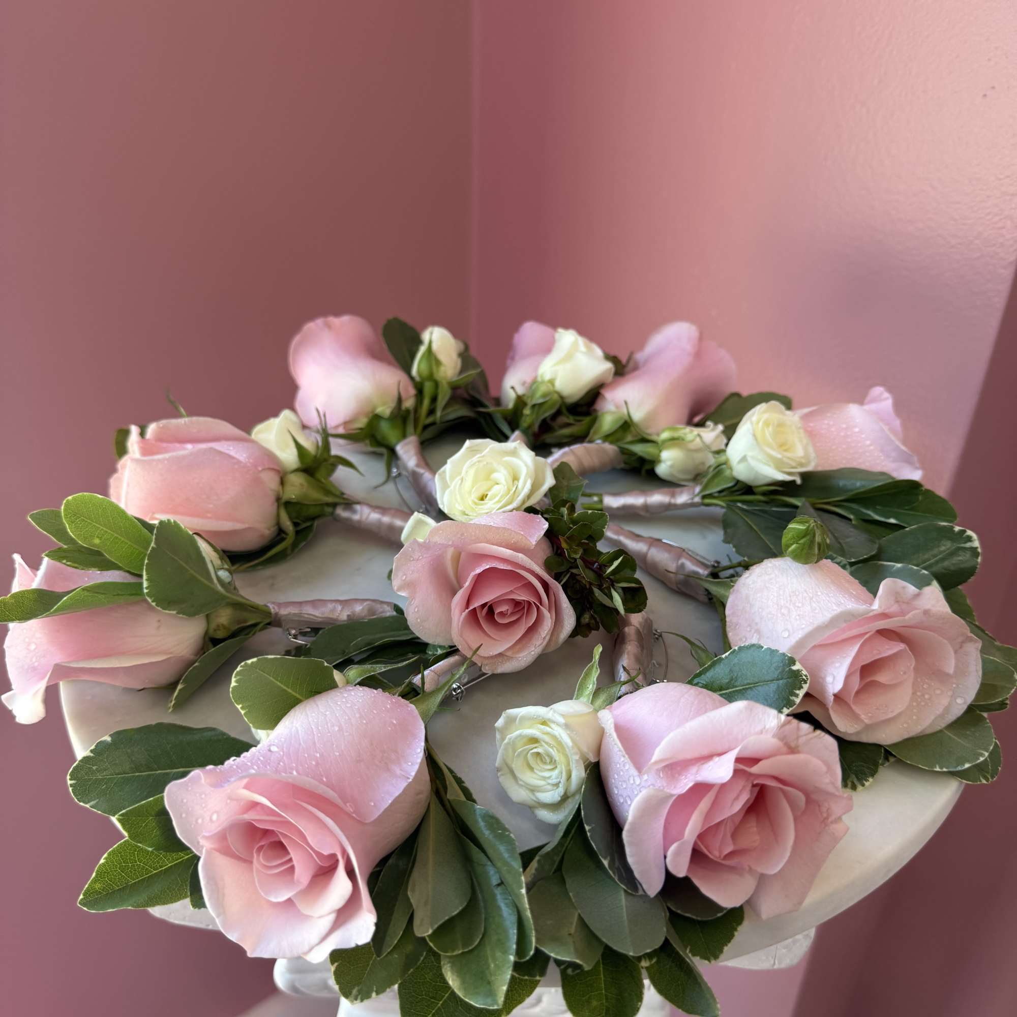 Typically worn on a lapel, it consists of a single rose bud.