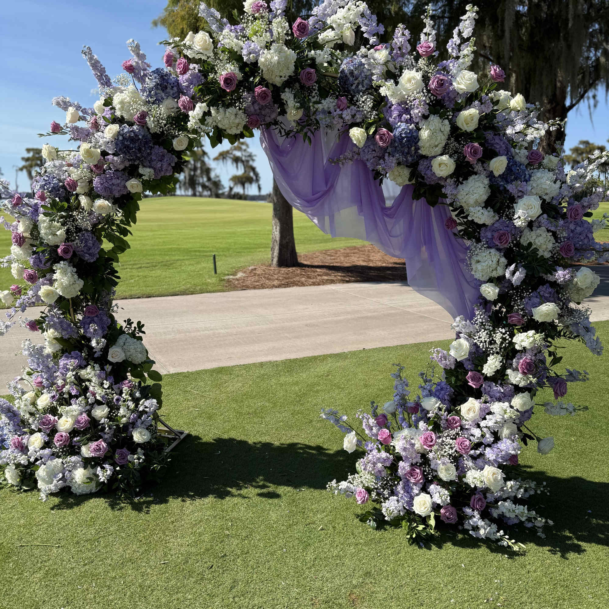 A dreamy floral arch designed to transform your ceremony into a fairytale
