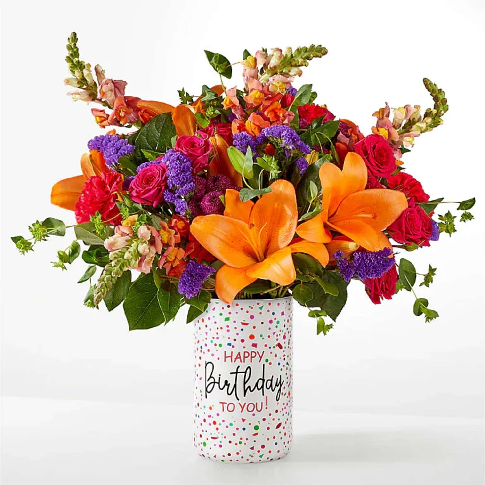 Colorful birthday arrangement in a ceramic birthday container. 
NOTE: We may use