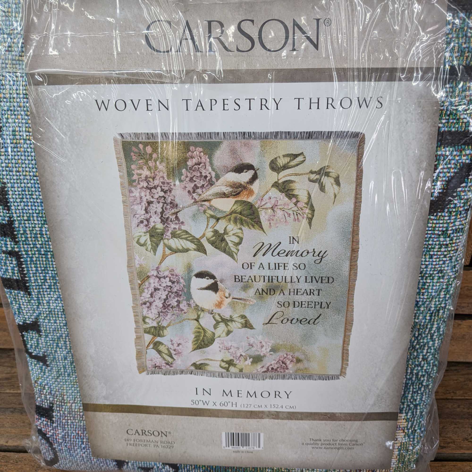 50" by 60" Throw. Machine washable. Comes displayed on stand.