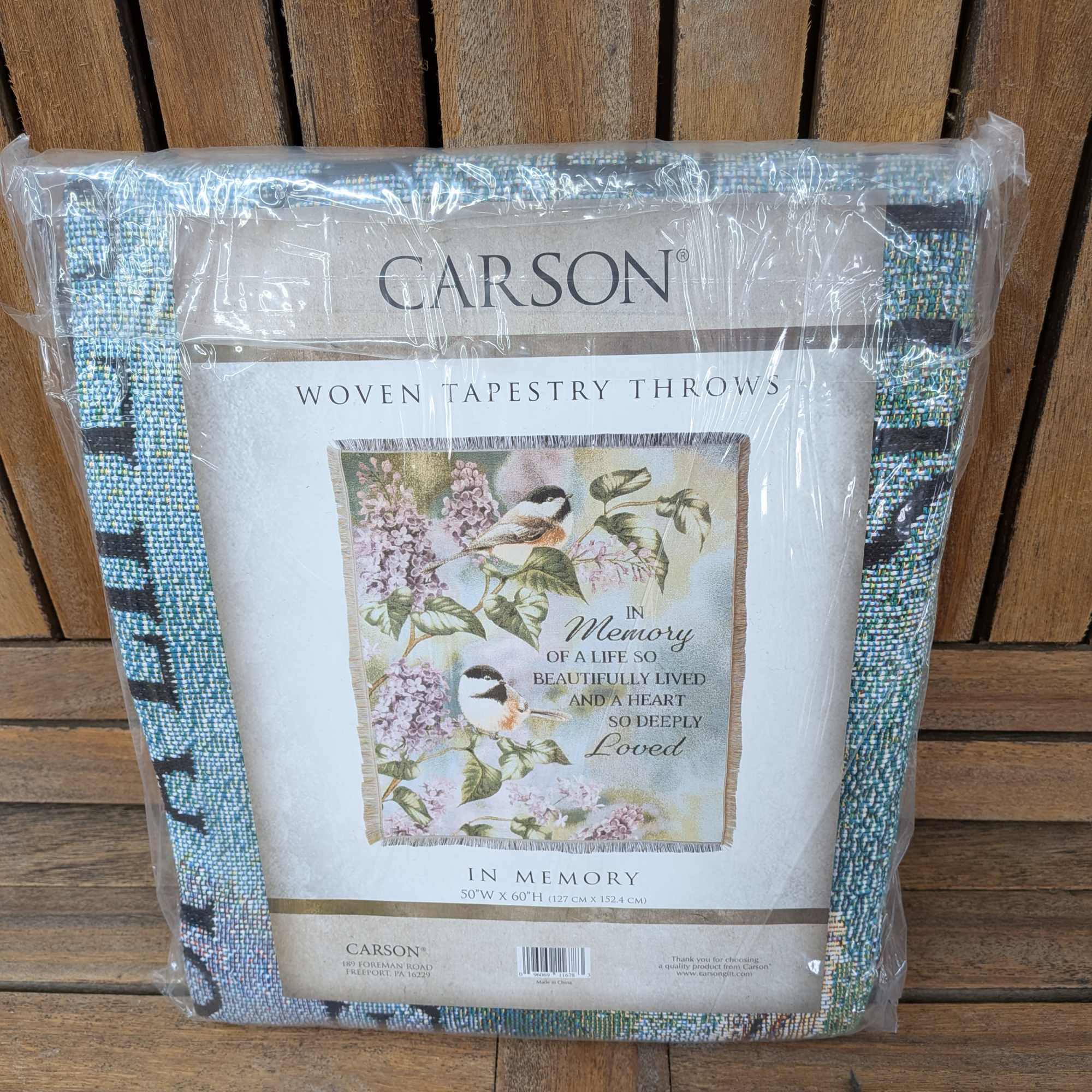 50" by 60" Throw. Machine washable. Comes displayed on stand.