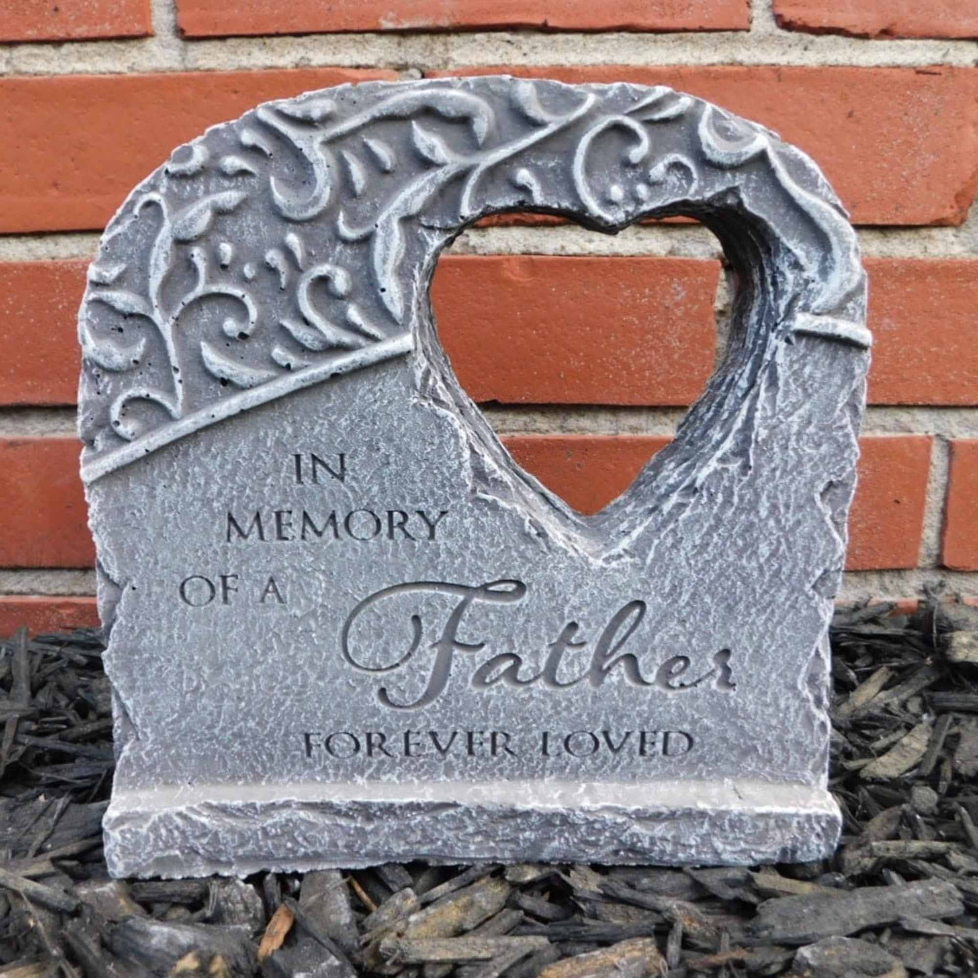 Stone memorial plaque reading "In Memory of a Father Forever Loved"