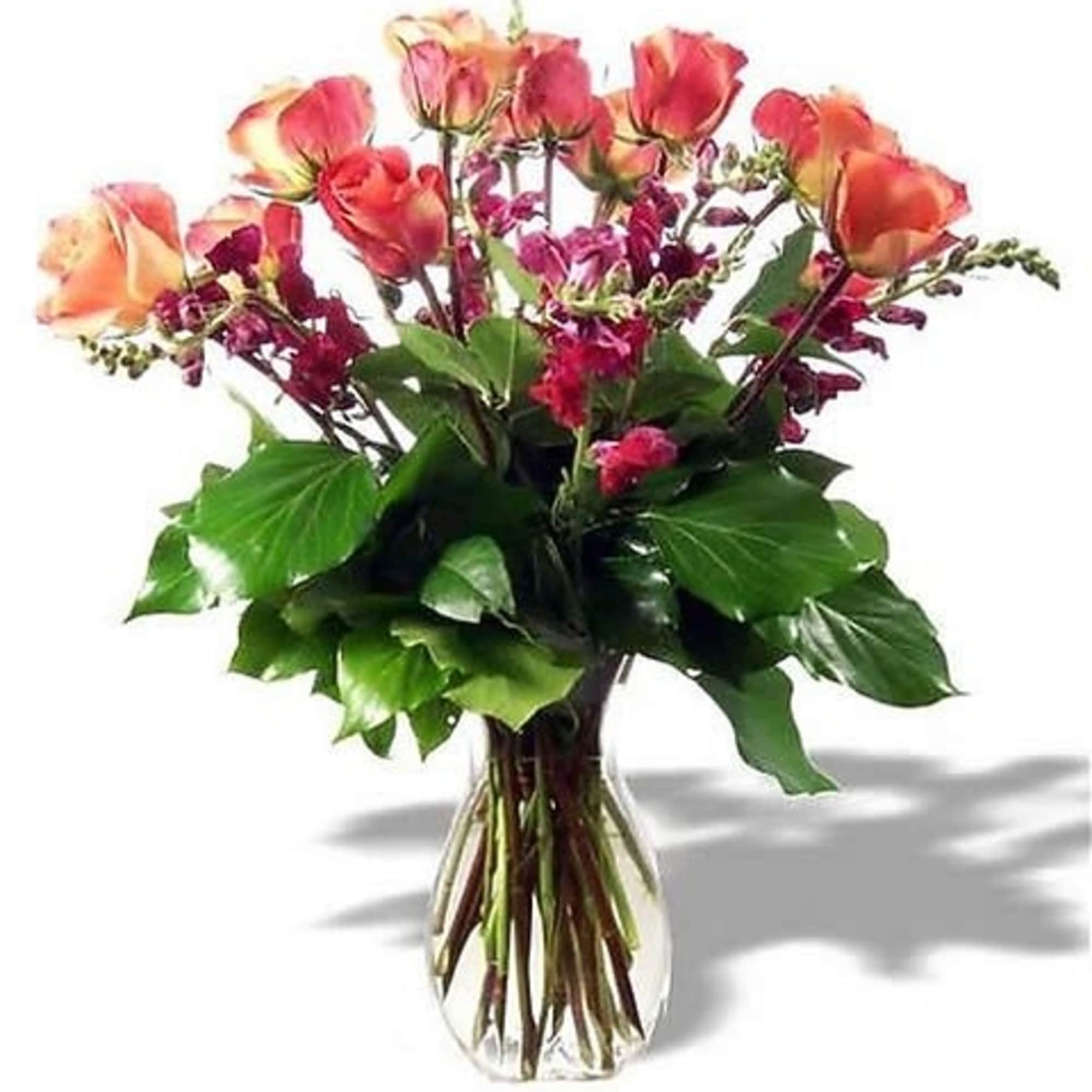 This graceful arrangement made of roses, snapdragons and lemon leaves stands tall