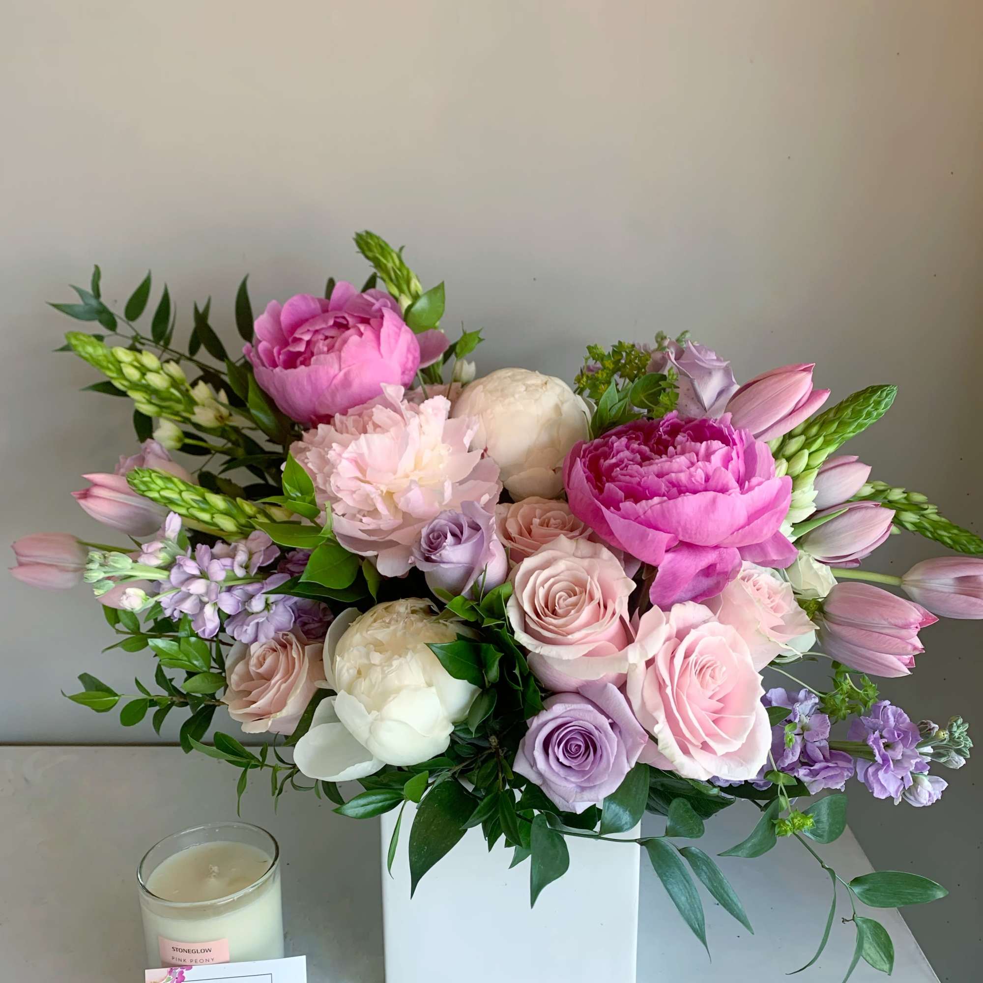 An assortment of Dutch peonies with ocean song and pink mondial roses