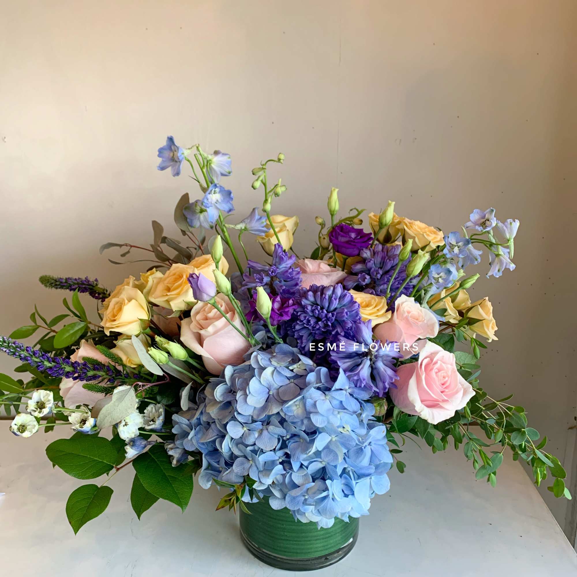 A beautiful combination of blue hyacinth from Holland, lush blue hydrangea and