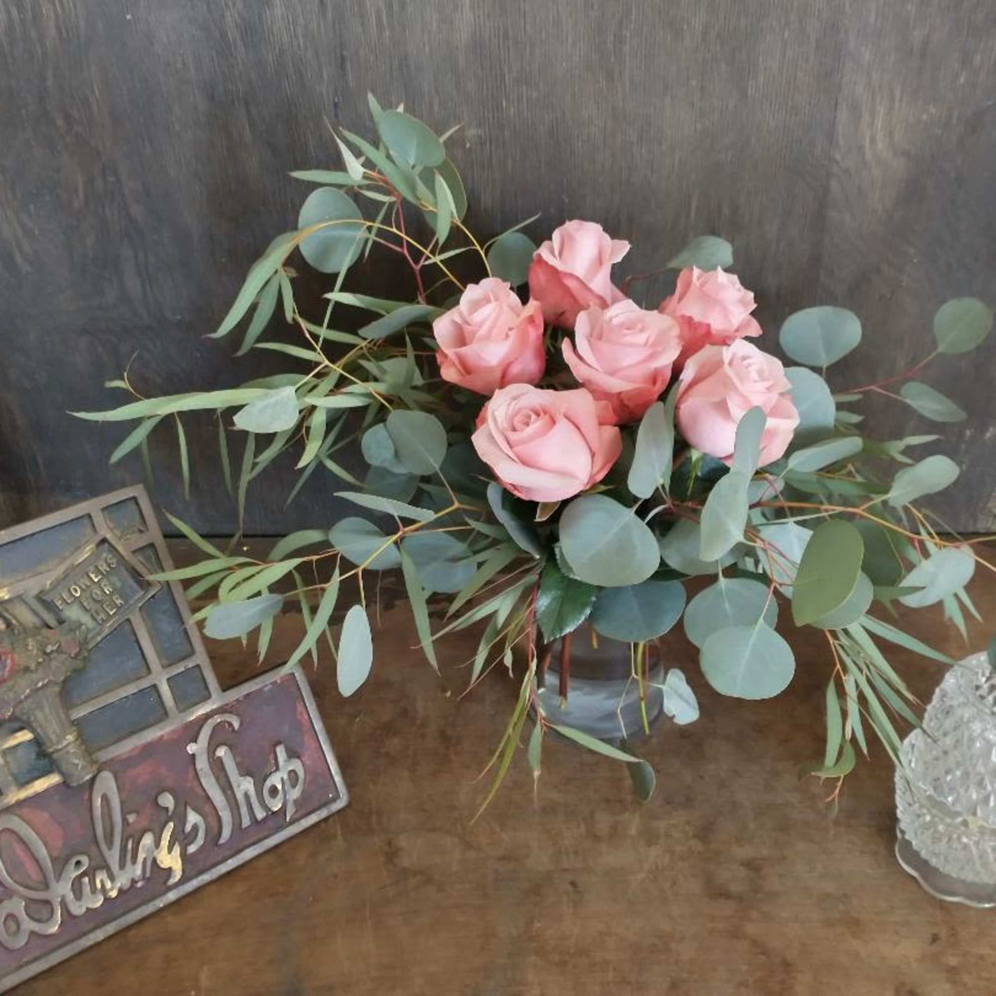A lovely arrangement of  6 rose filler fashion with feather eucalyptus
