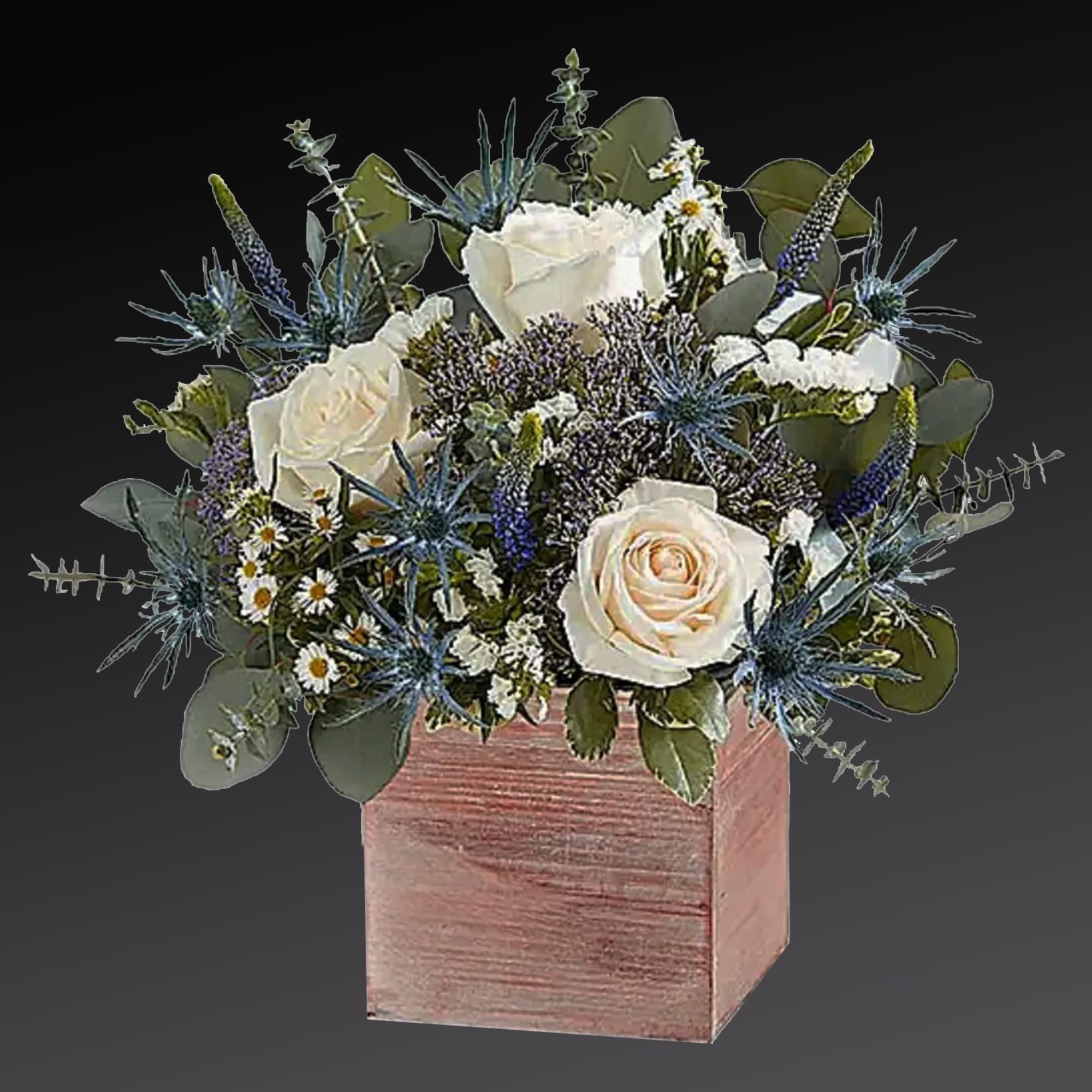 White roses and blue thistle in a pink wooden box