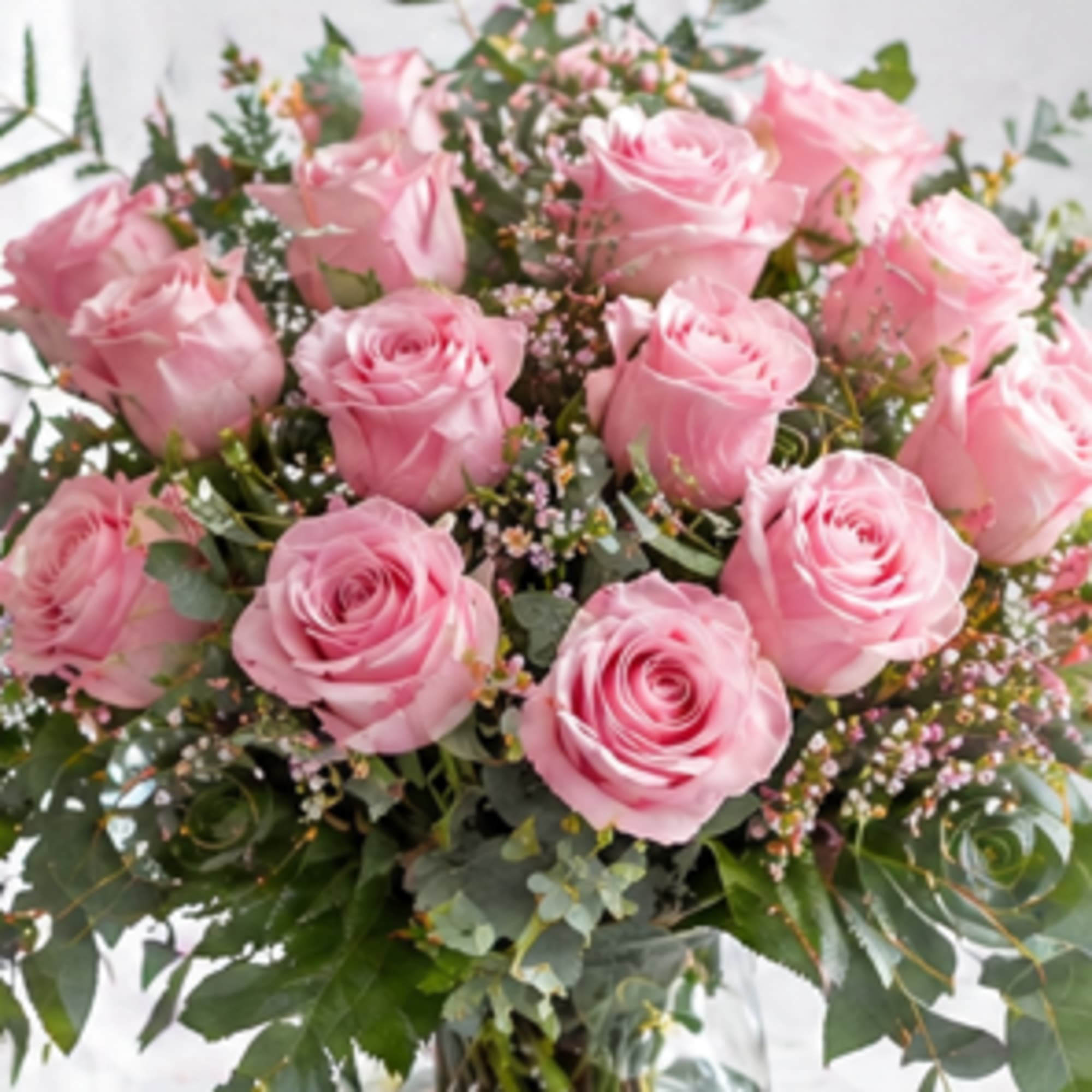 Picture-perfect soft pink roses make a beautiful gift for the lovely lady