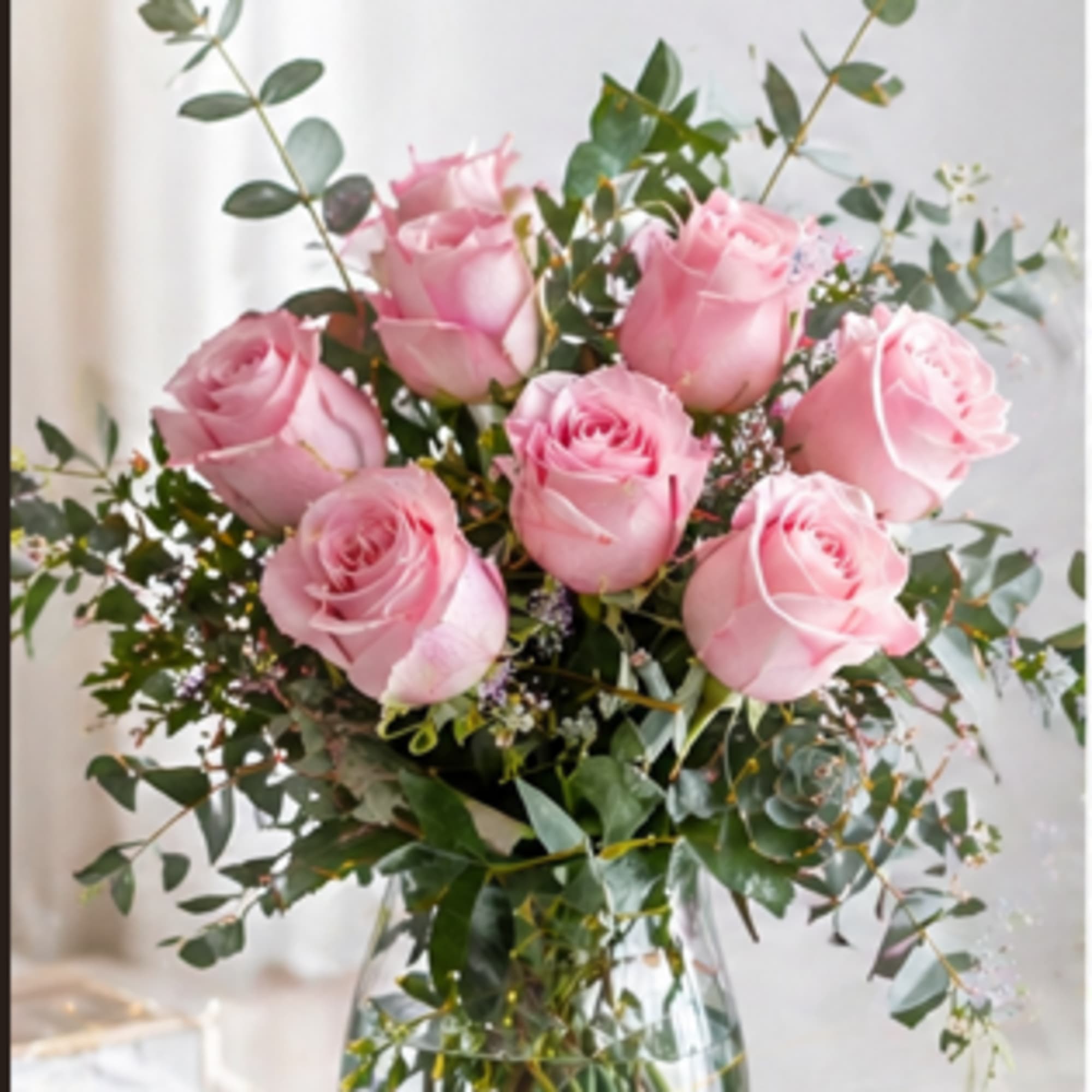 Picture-perfect soft pink roses make a beautiful gift for the lovely lady