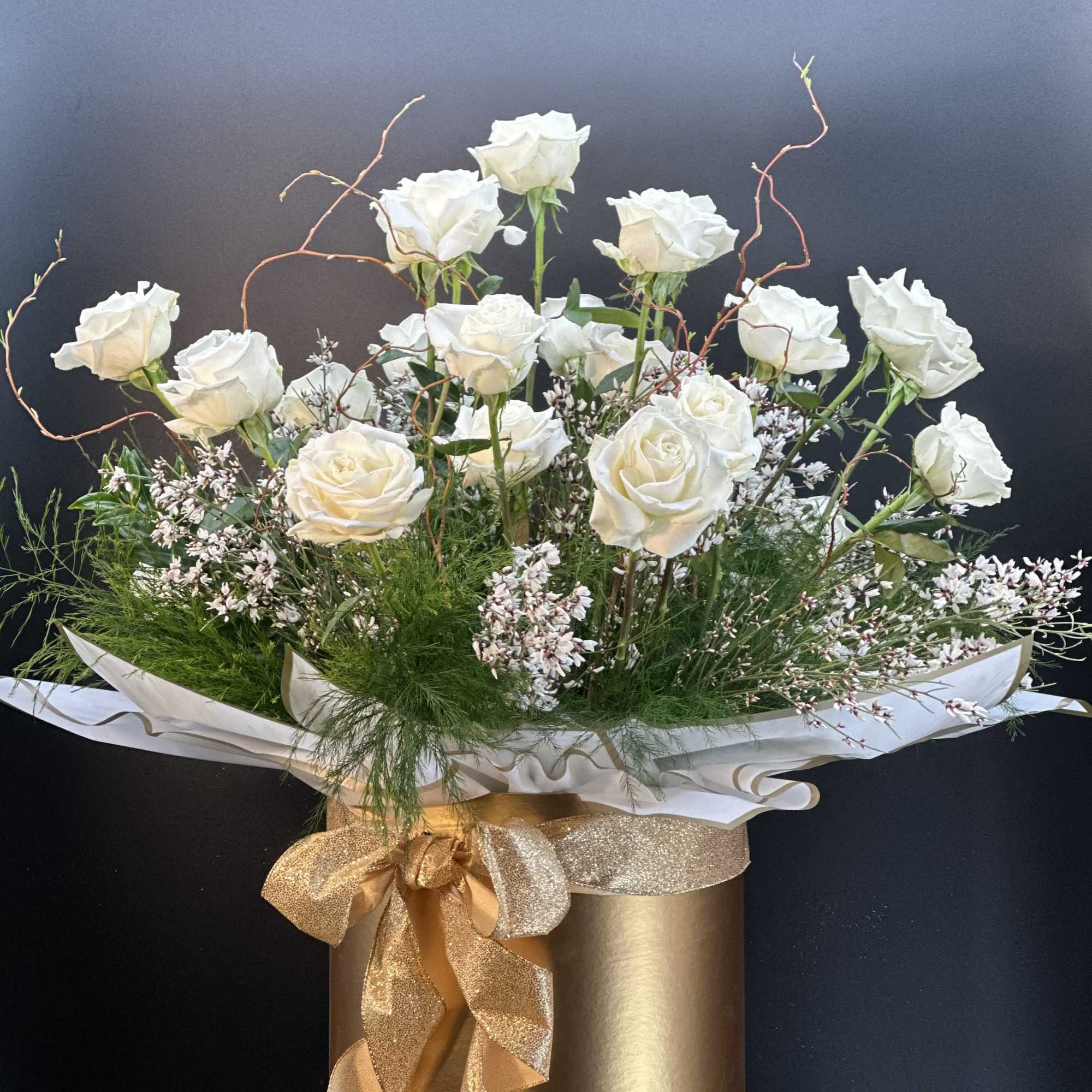 A striking arrangement of velvety red  hearts roses ,artfully composed with