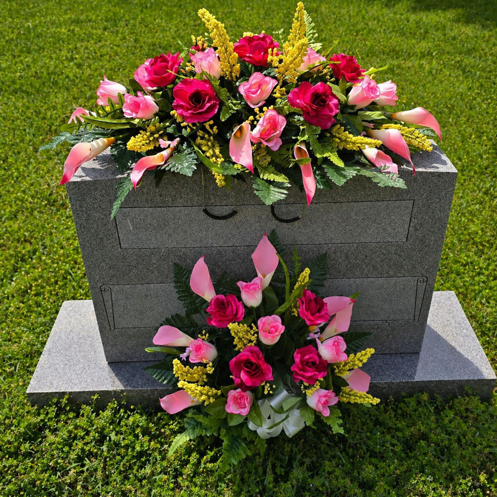 Bright pink roses and pink-and-white calla lilies create a dignified, uplifting graveside