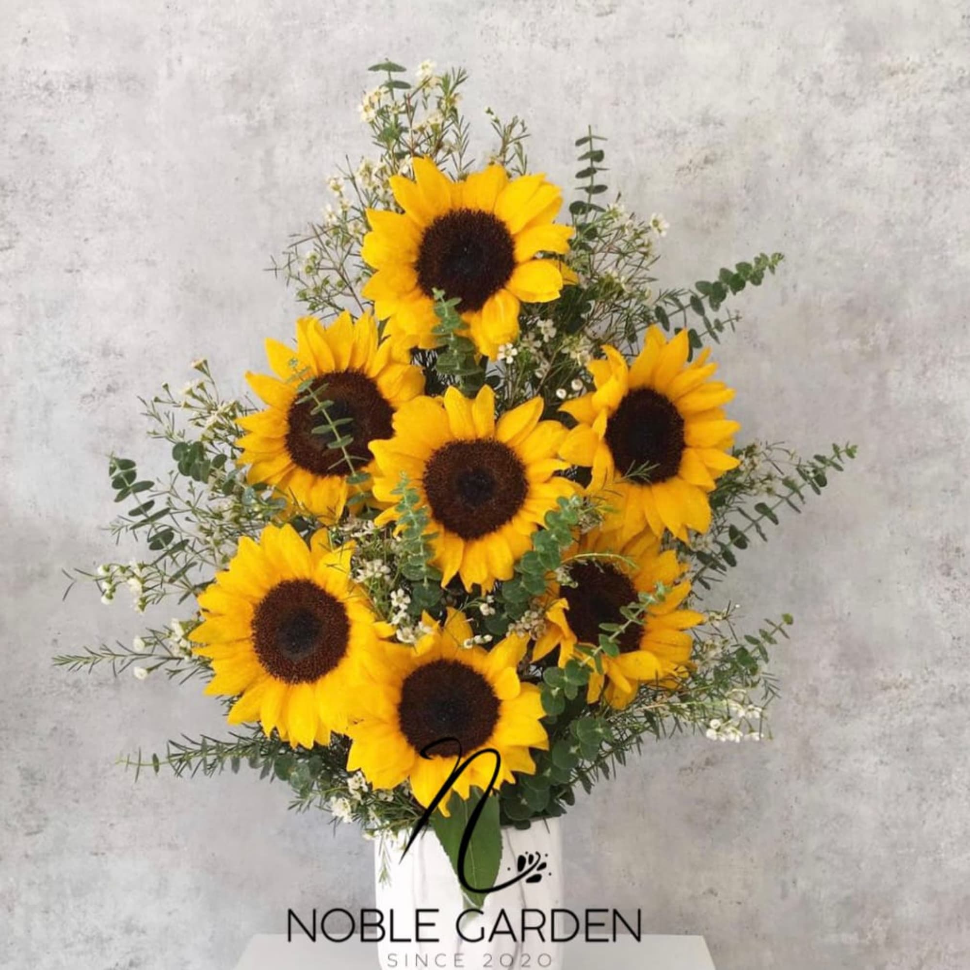 Bouquet of sunflowers in a white vase