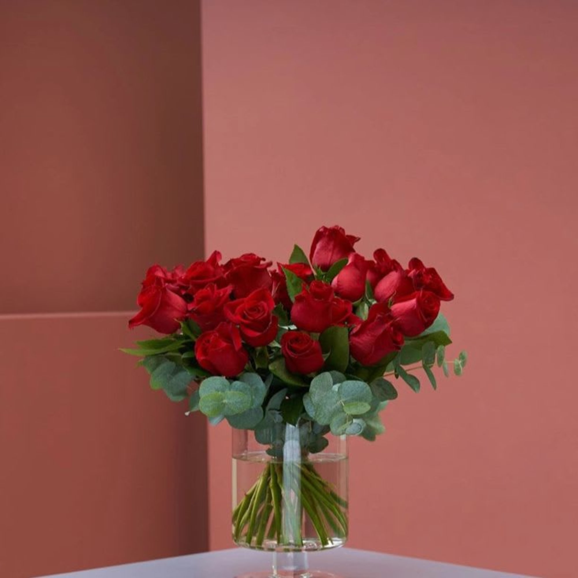 Bouquet of red roses in a clear glass vase