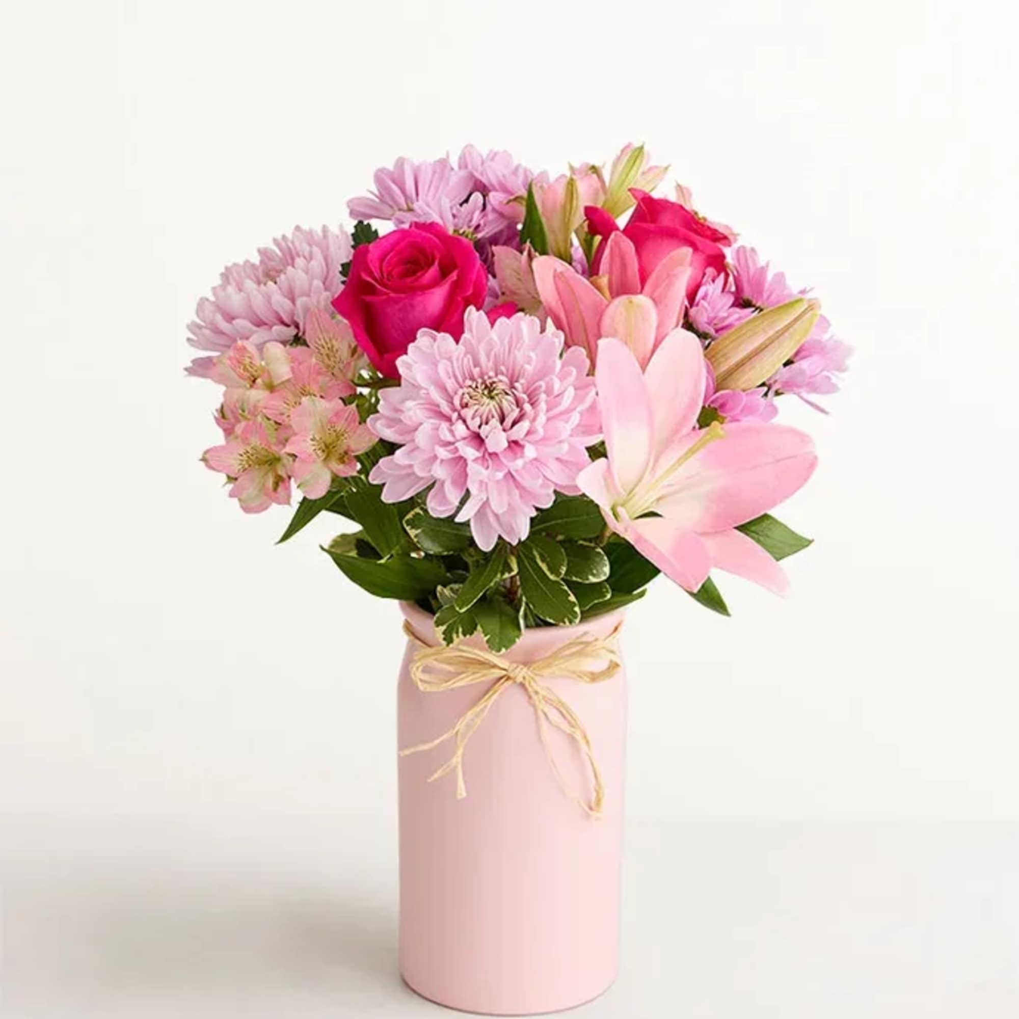 Bright pink roses and pale pink lilies give this Mother's Embrace 2