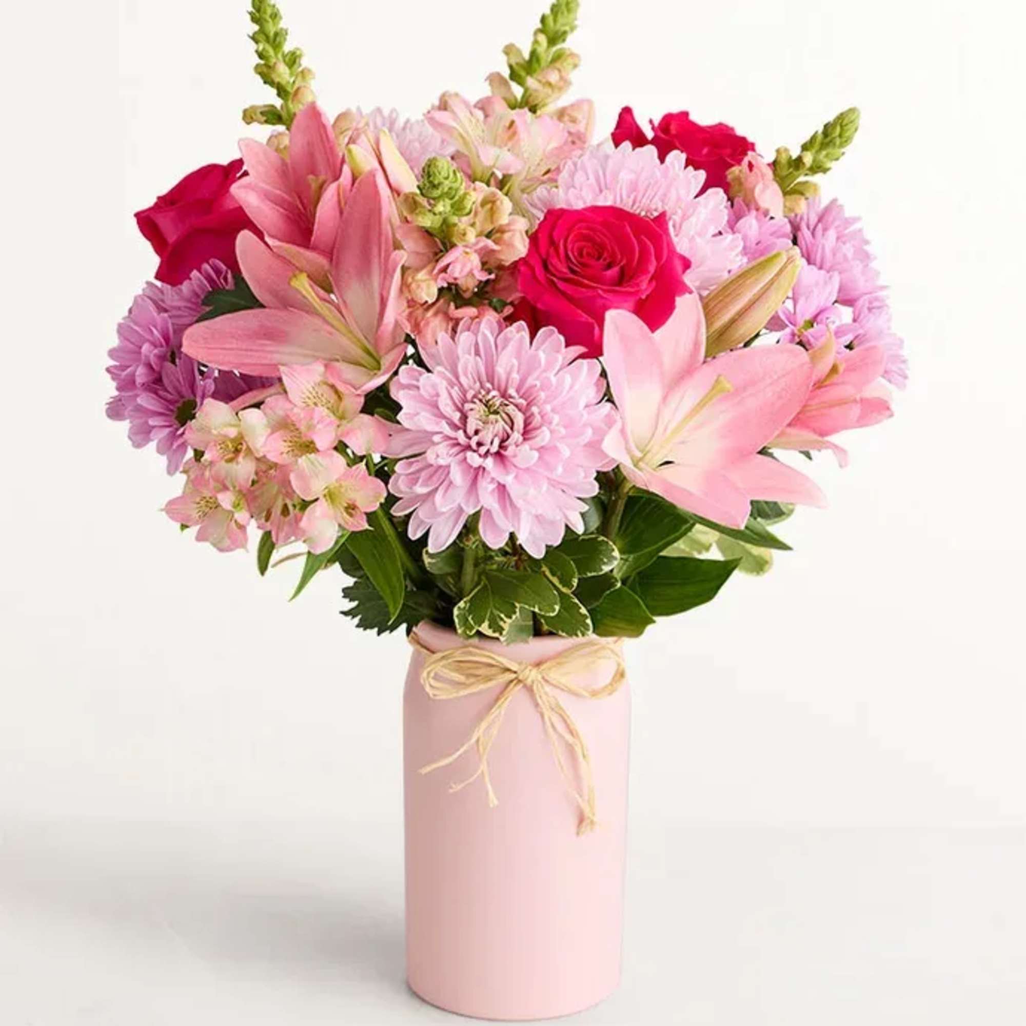 Bright pink roses and pale pink lilies give this Mother's Embrace 2