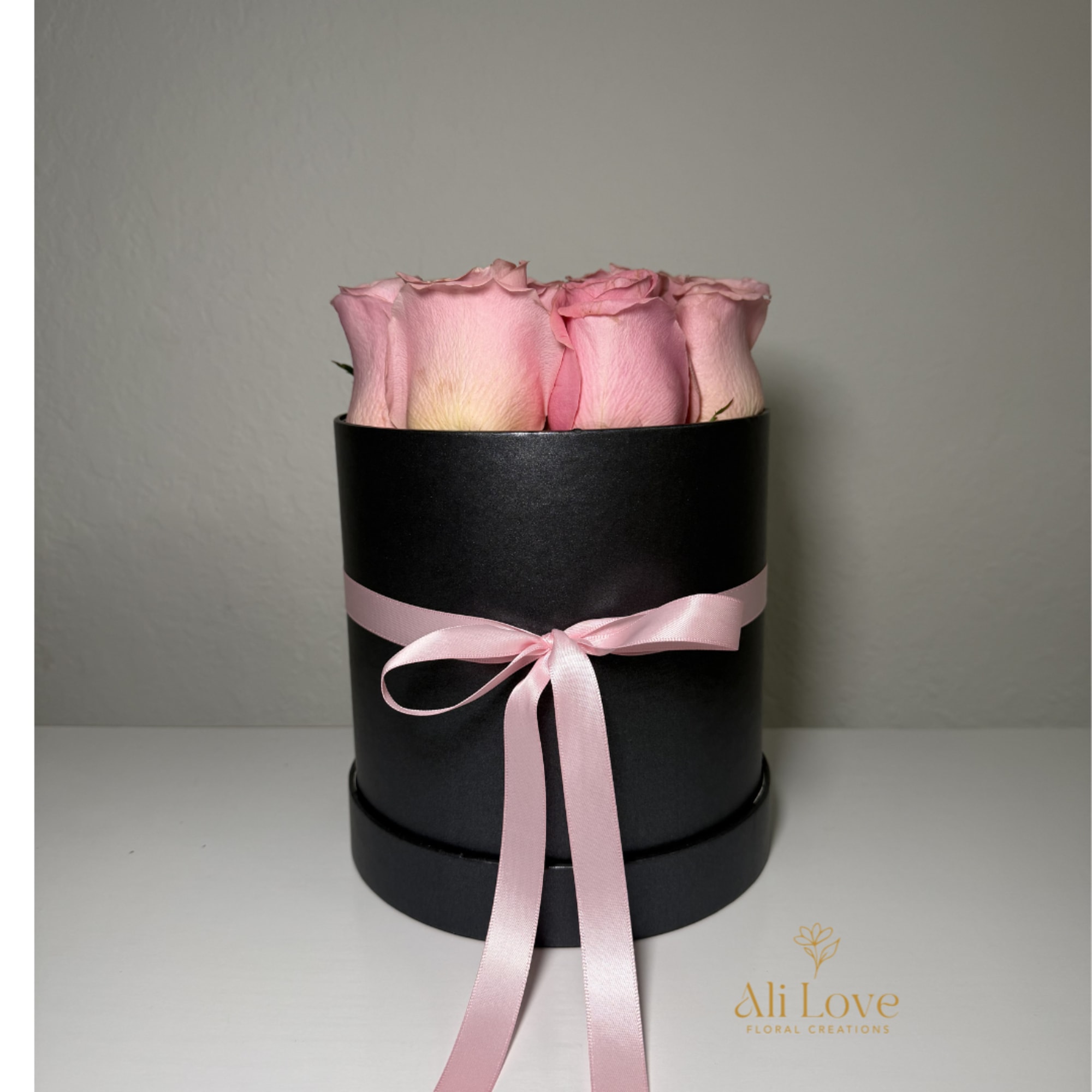 fresh roses carefully arranged in a stylish box, perfect for gifting and