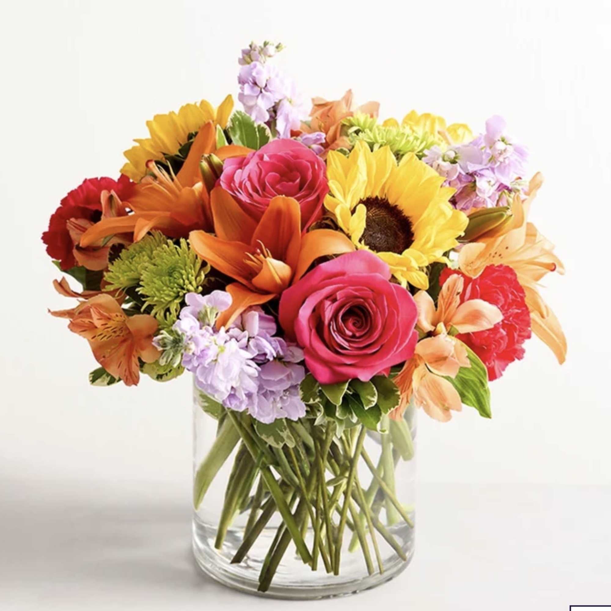 Like a warm embrace, this vibrant flower bouquet delivers your sentiments to