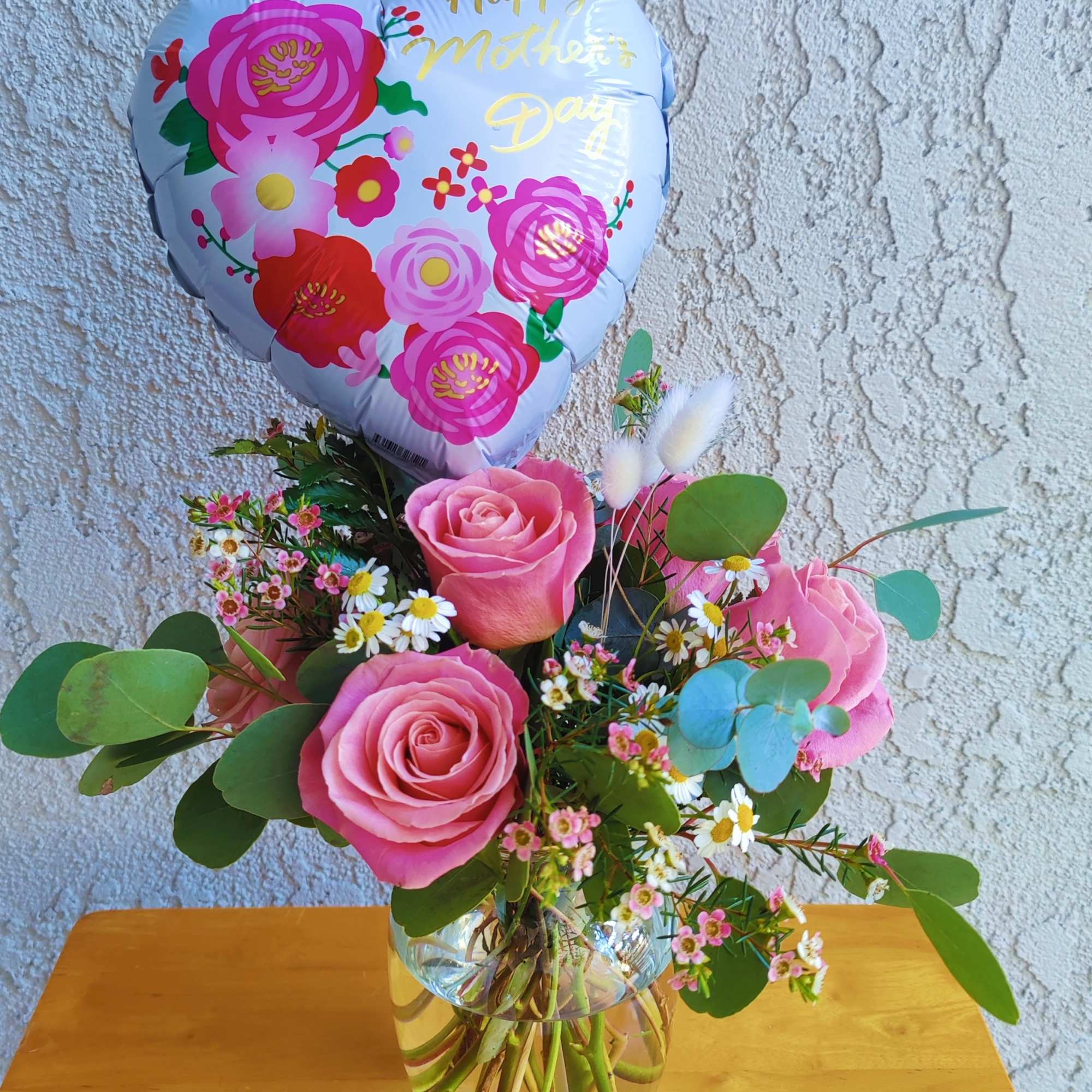 Celebrate mother's Day with this beautiful rose arrangement; it is designed with