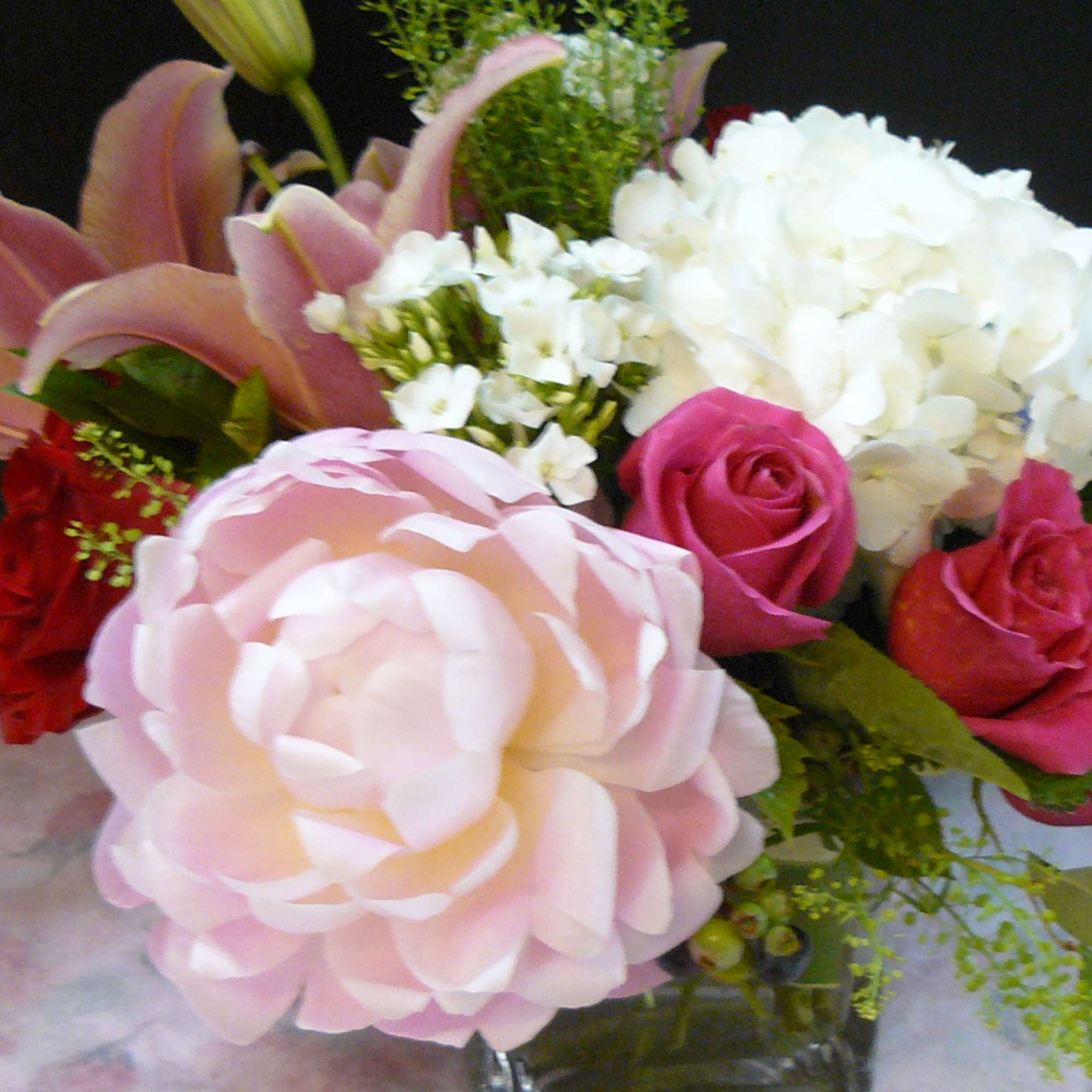 Bouquet of pink and white flowers in a glass vase