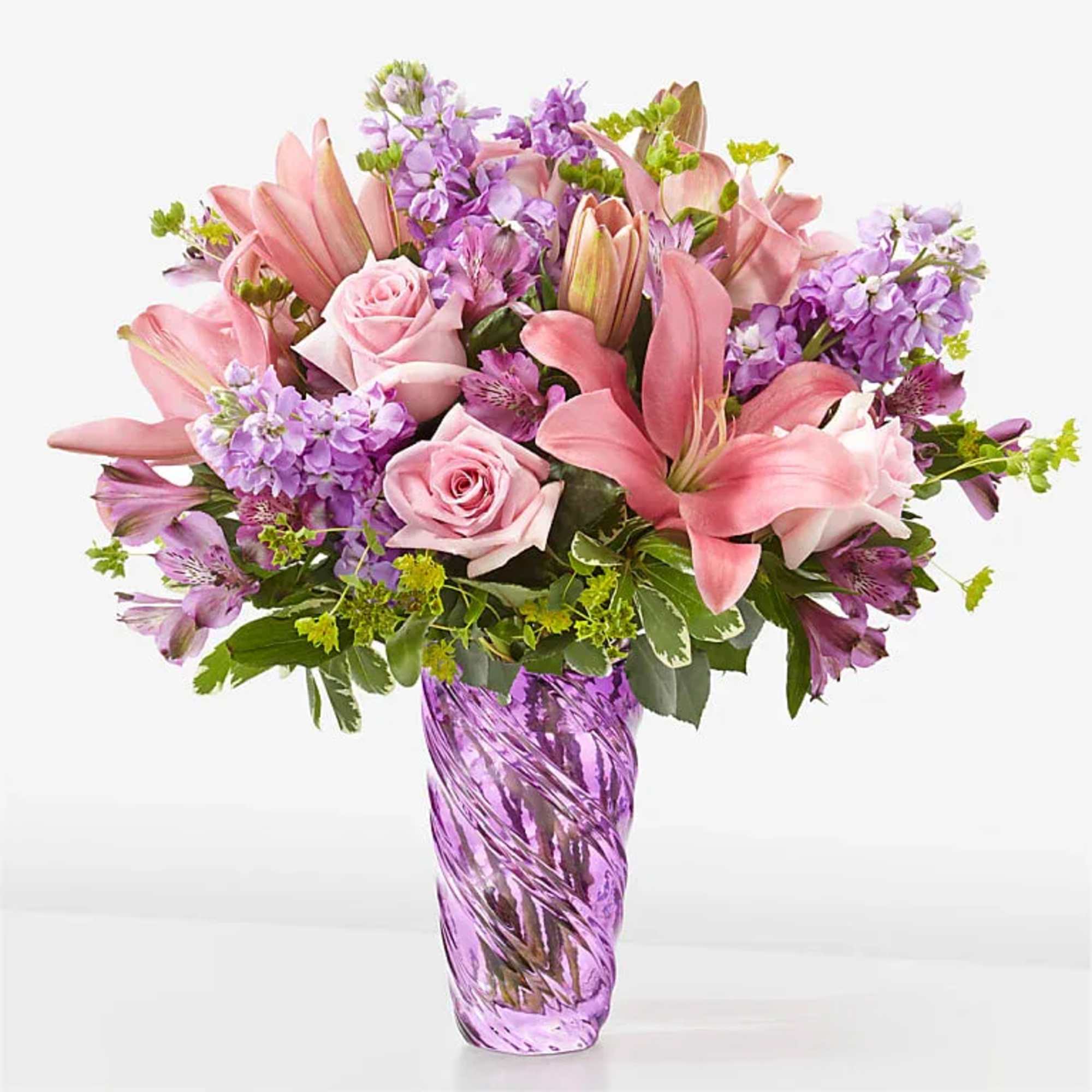 Precious Petals Bouquet with Luxe Swirl Vase
The beauty of spring can be