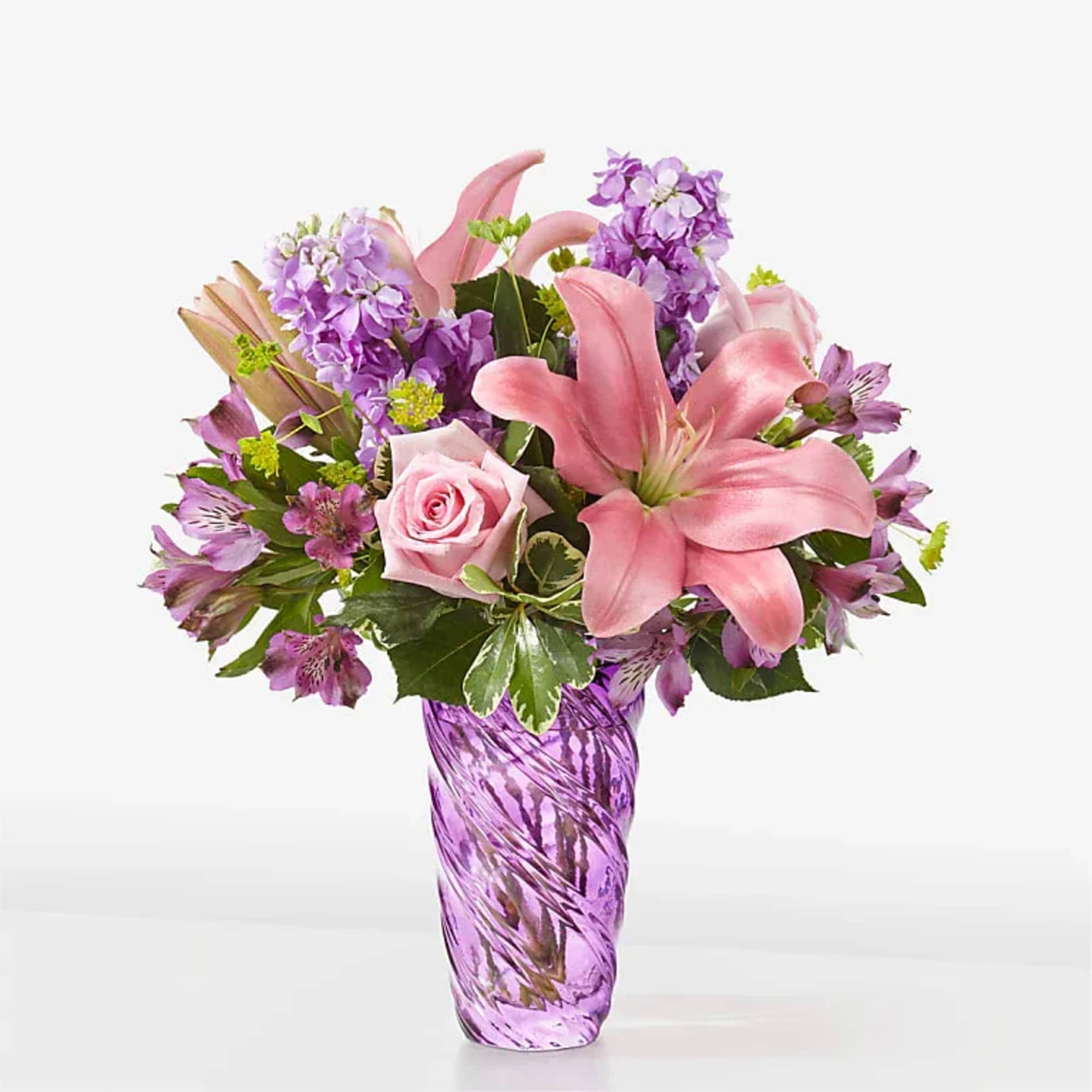 Precious Petals Bouquet with Luxe Swirl Vase
The beauty of spring can be