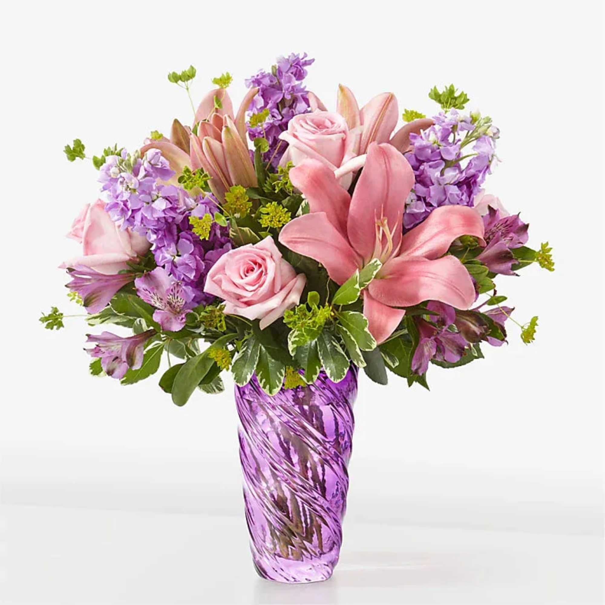 Precious Petals Bouquet with Luxe Swirl Vase
The beauty of spring can be