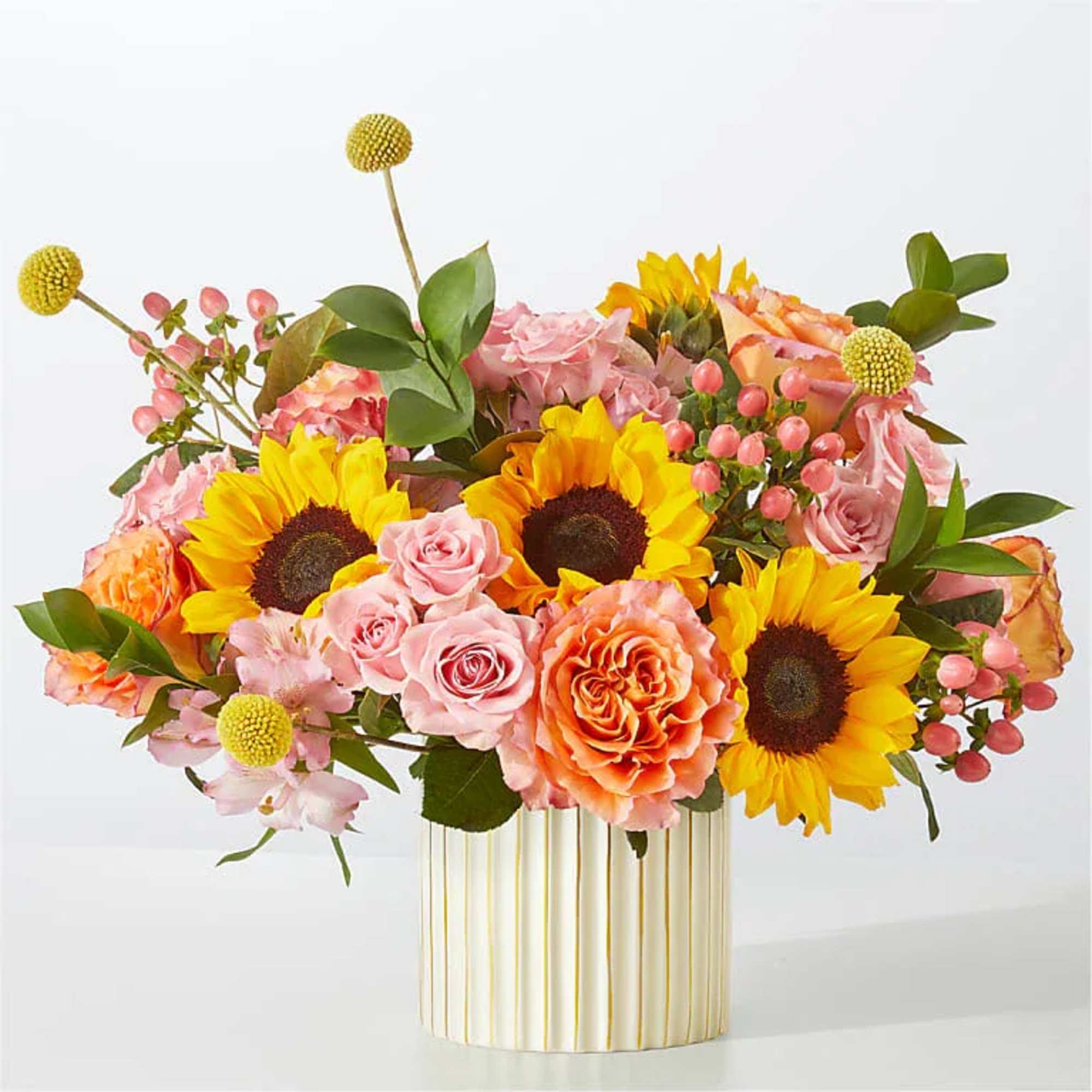 Sun's Out Bouquet
A combination as sweet as citrus, these peach, orange and