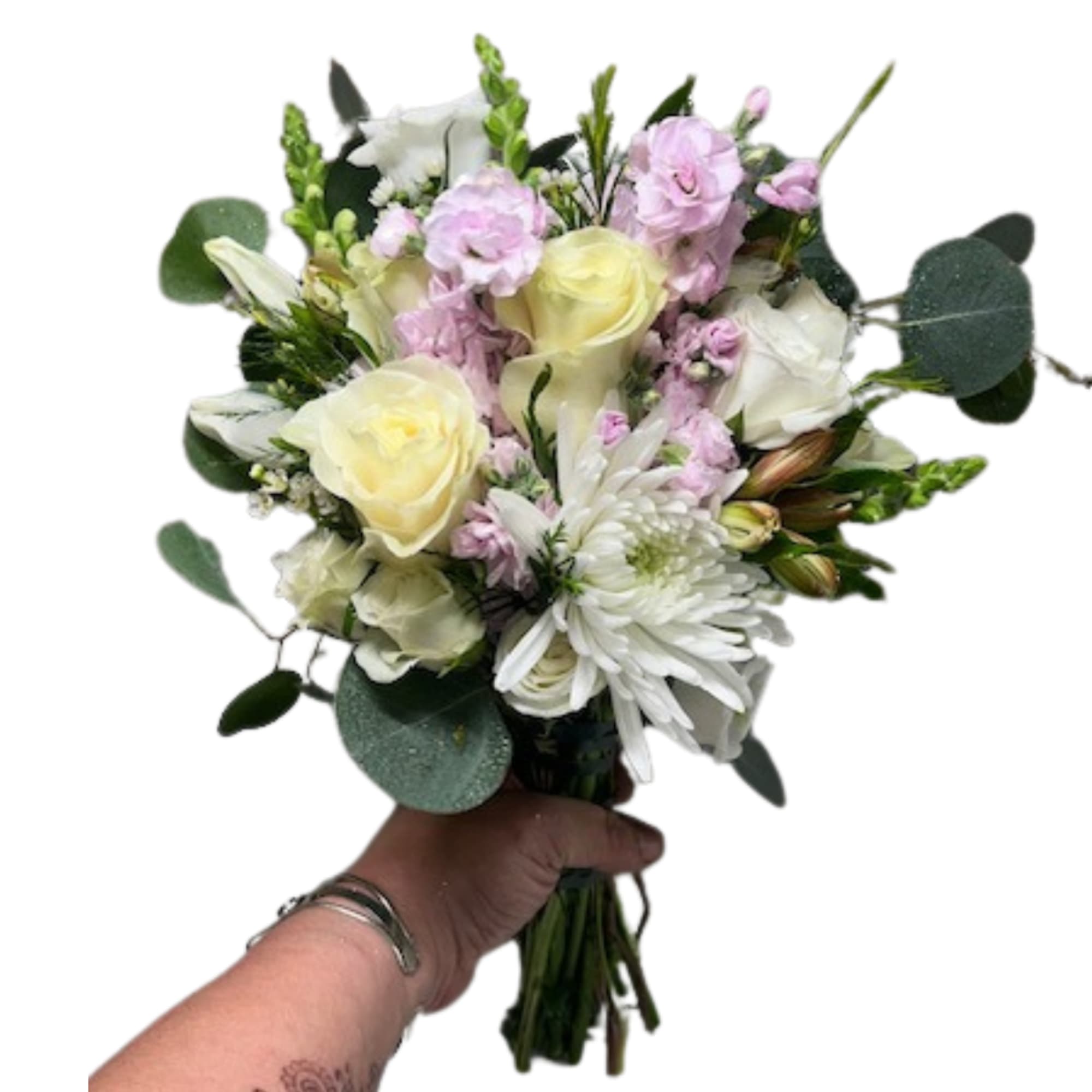 Handheld bouquet of white and pale pink flowers with greenery
