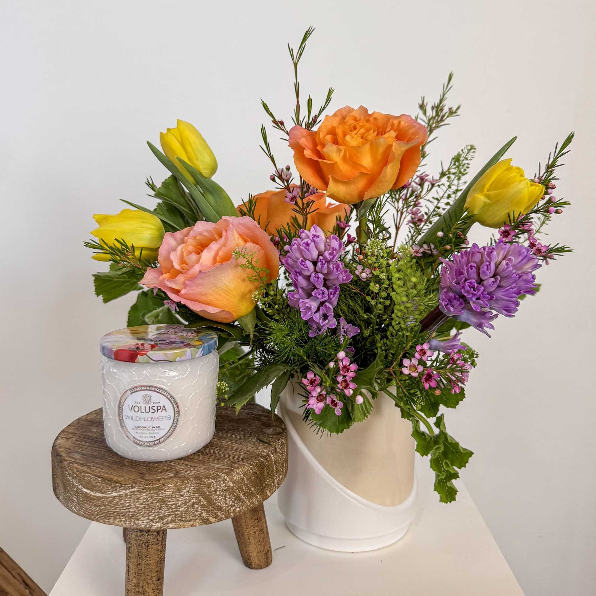 A wildflower inspired arrangement pairs beautifully with a wildflower scented candle (Voluspa's