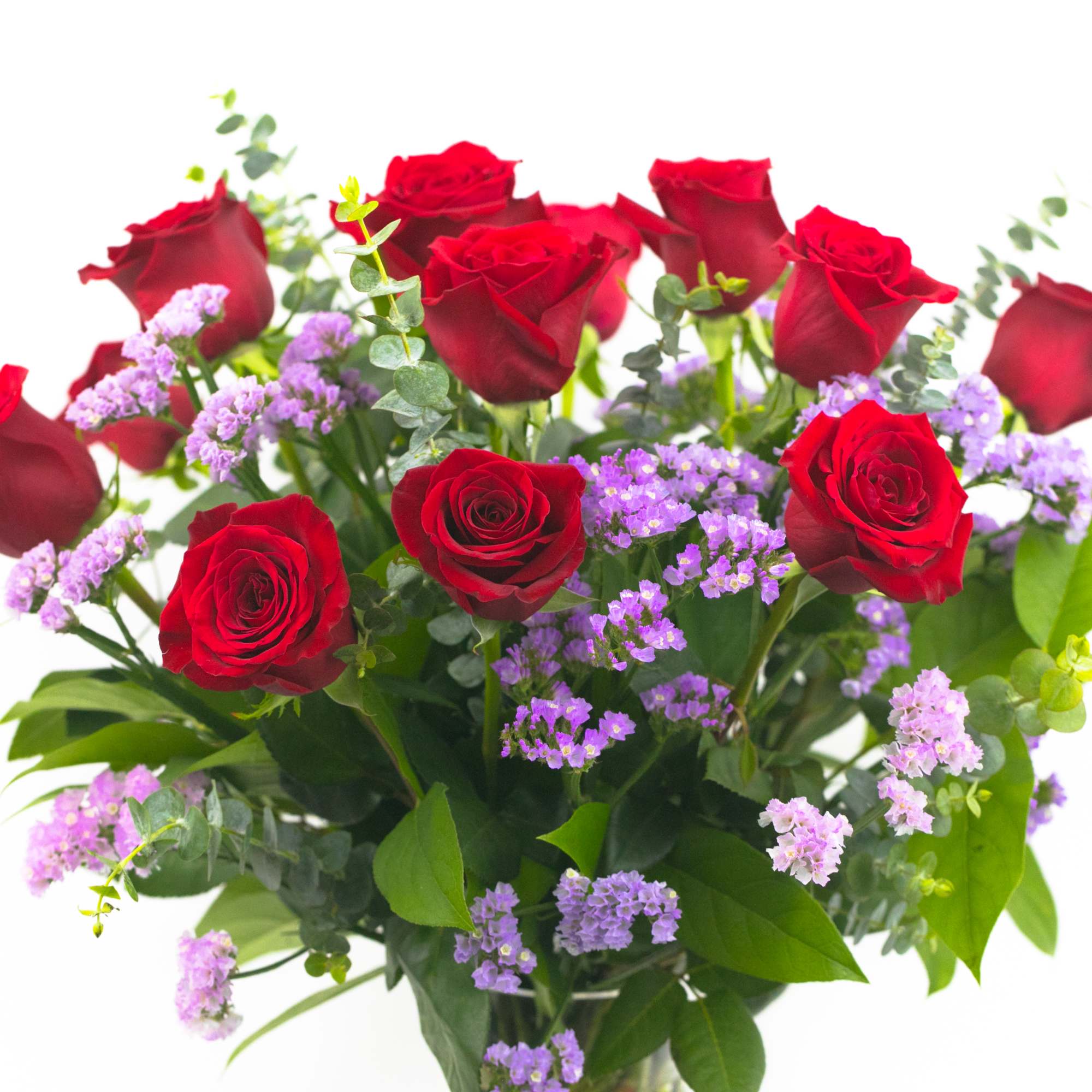 Bouquet of red roses with small purple filler flowers