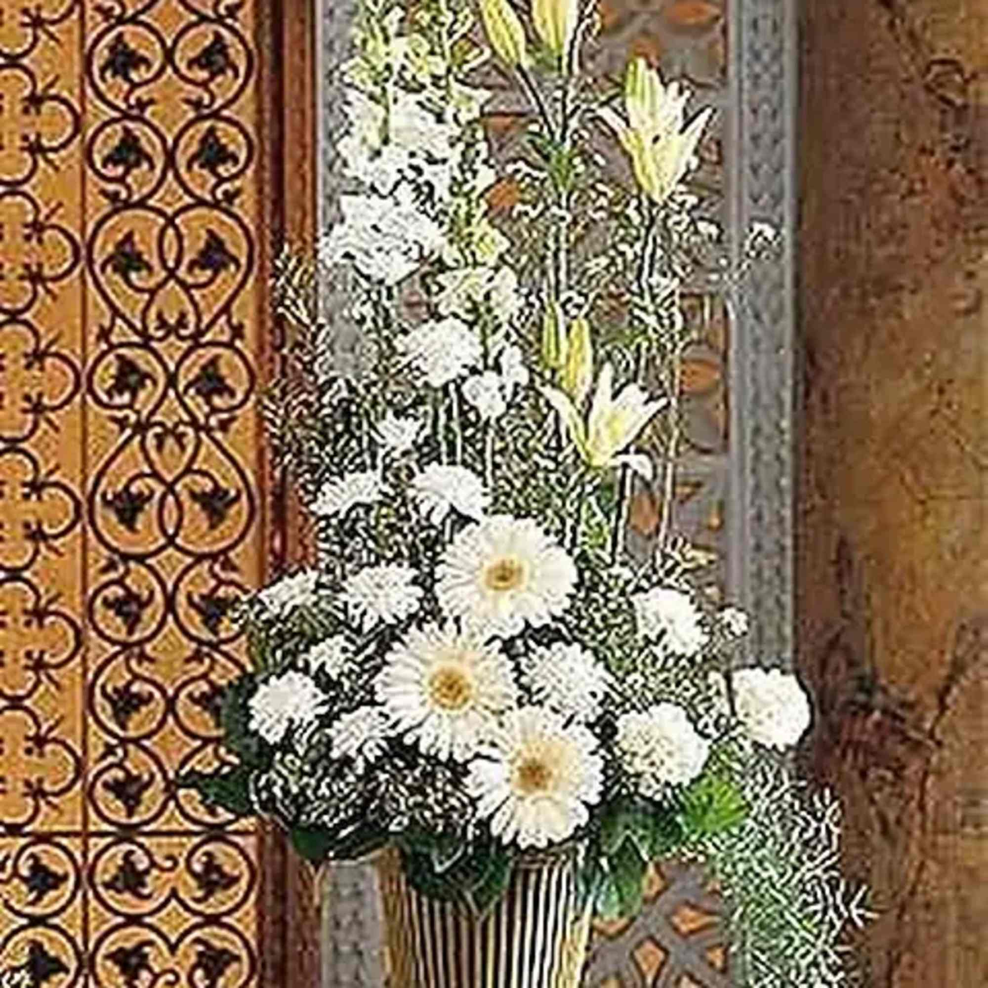 With its striking array of white flowers, this arrangement will fill any
