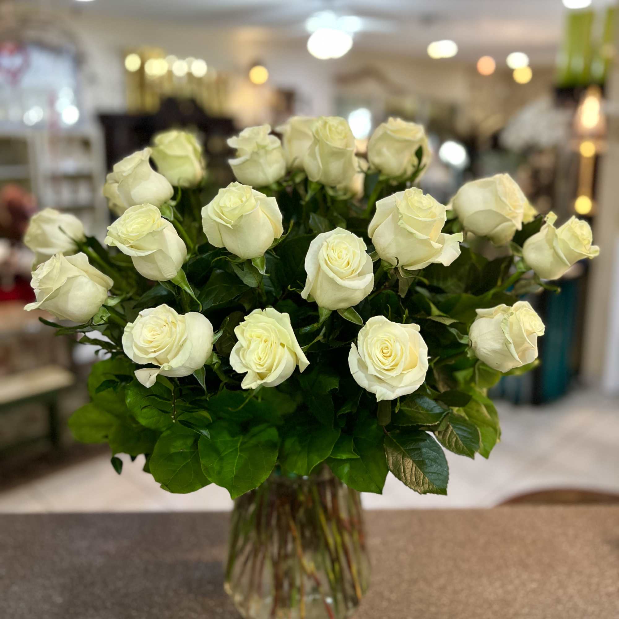 Bouquet of white roses in a clear glass vase