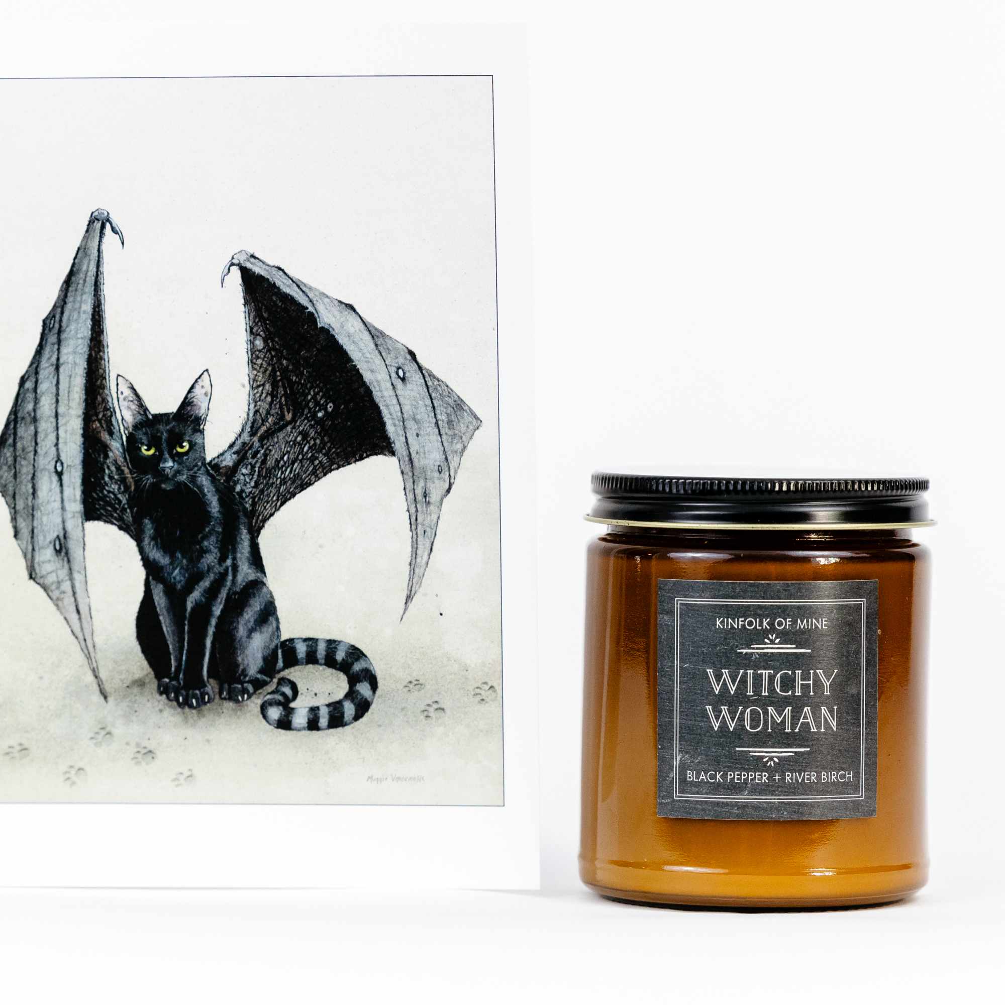A bat illustration card beside an amber candle jar labeled Witchy Woman.