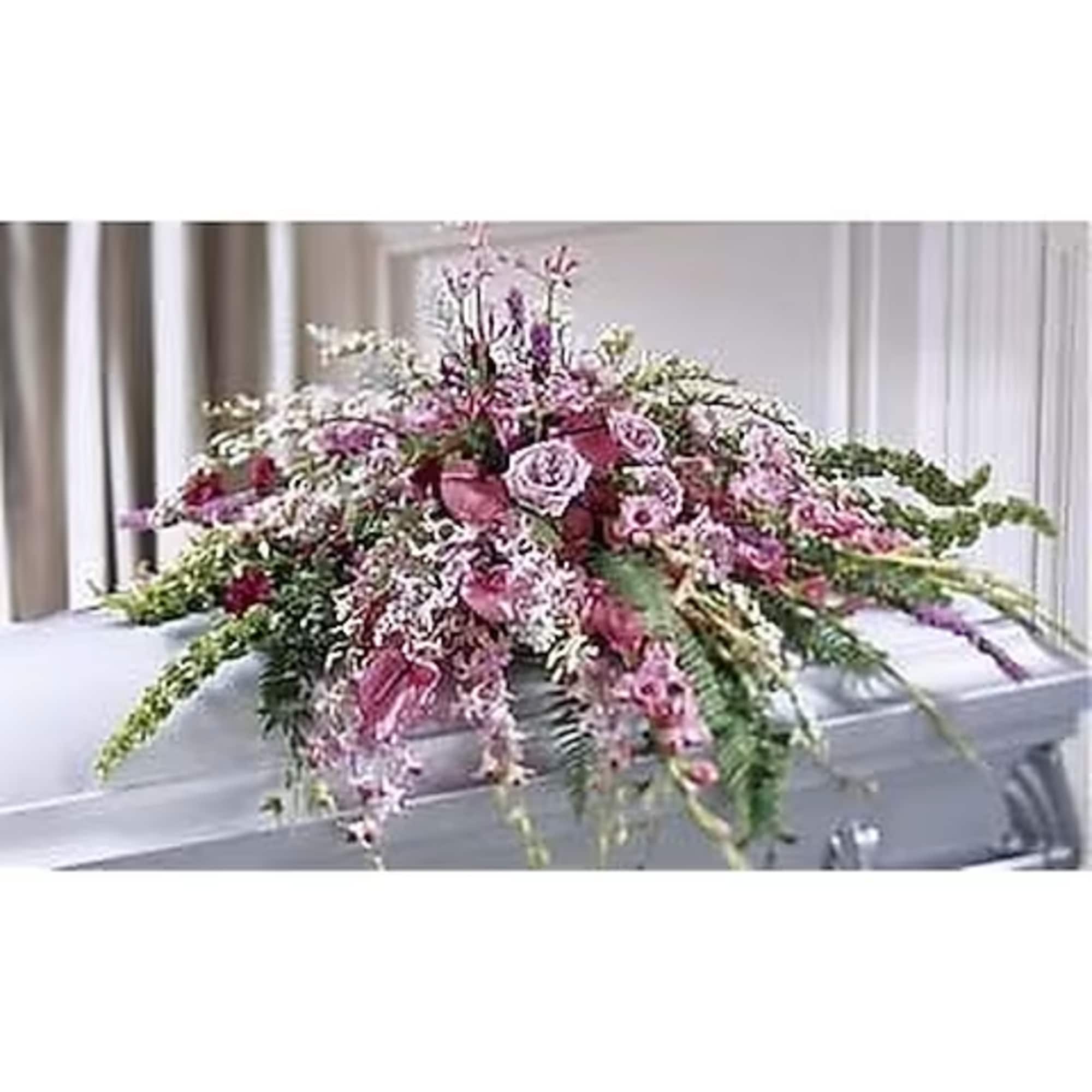 This thoughtful gesture of sympathy displays and abundance of purples and lavenders