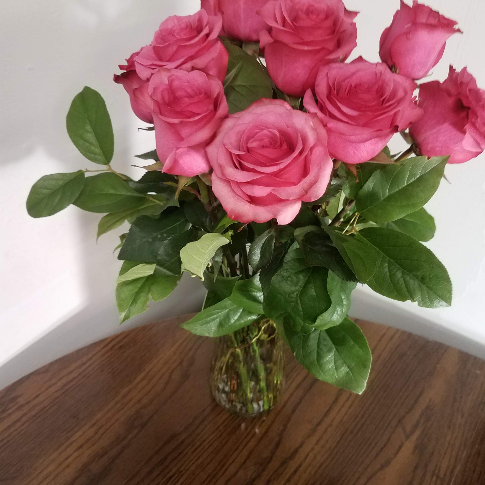 Pink roses in a clear glass vase