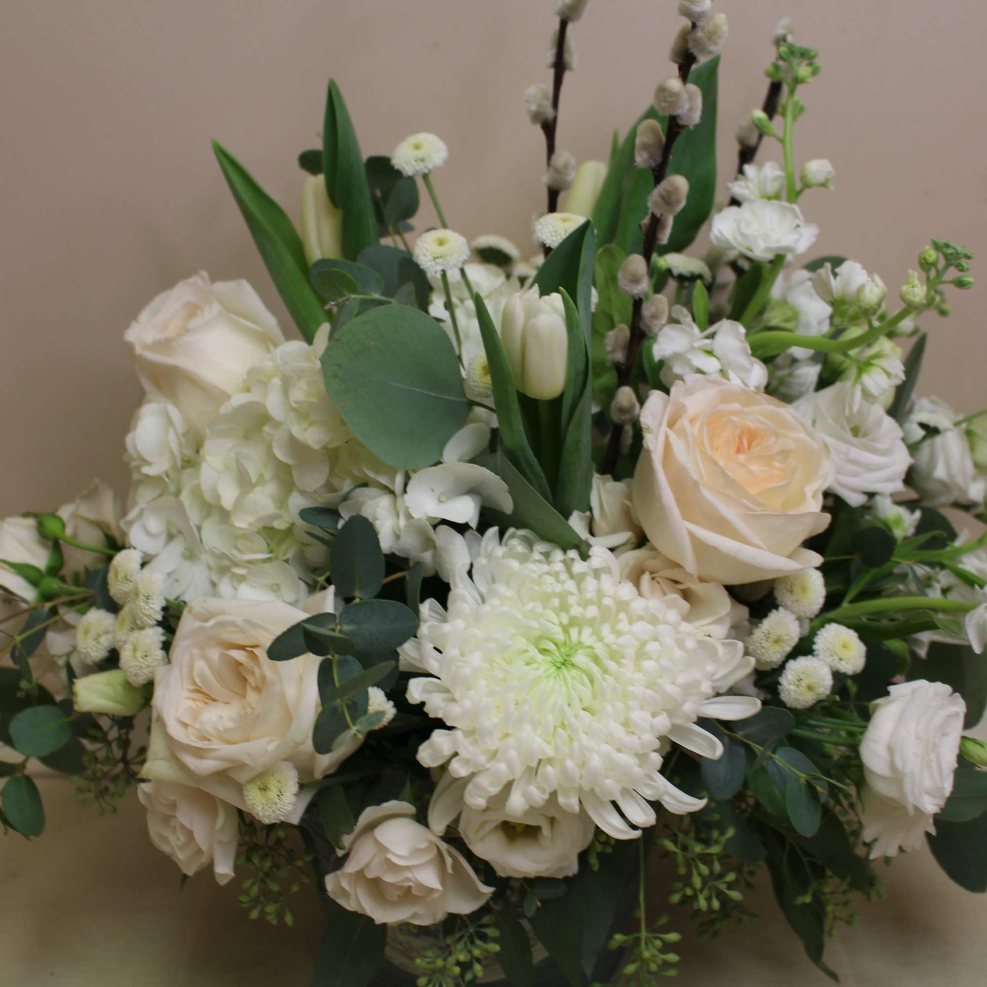 White and cream floral arrangement with roses and chrysanthemums