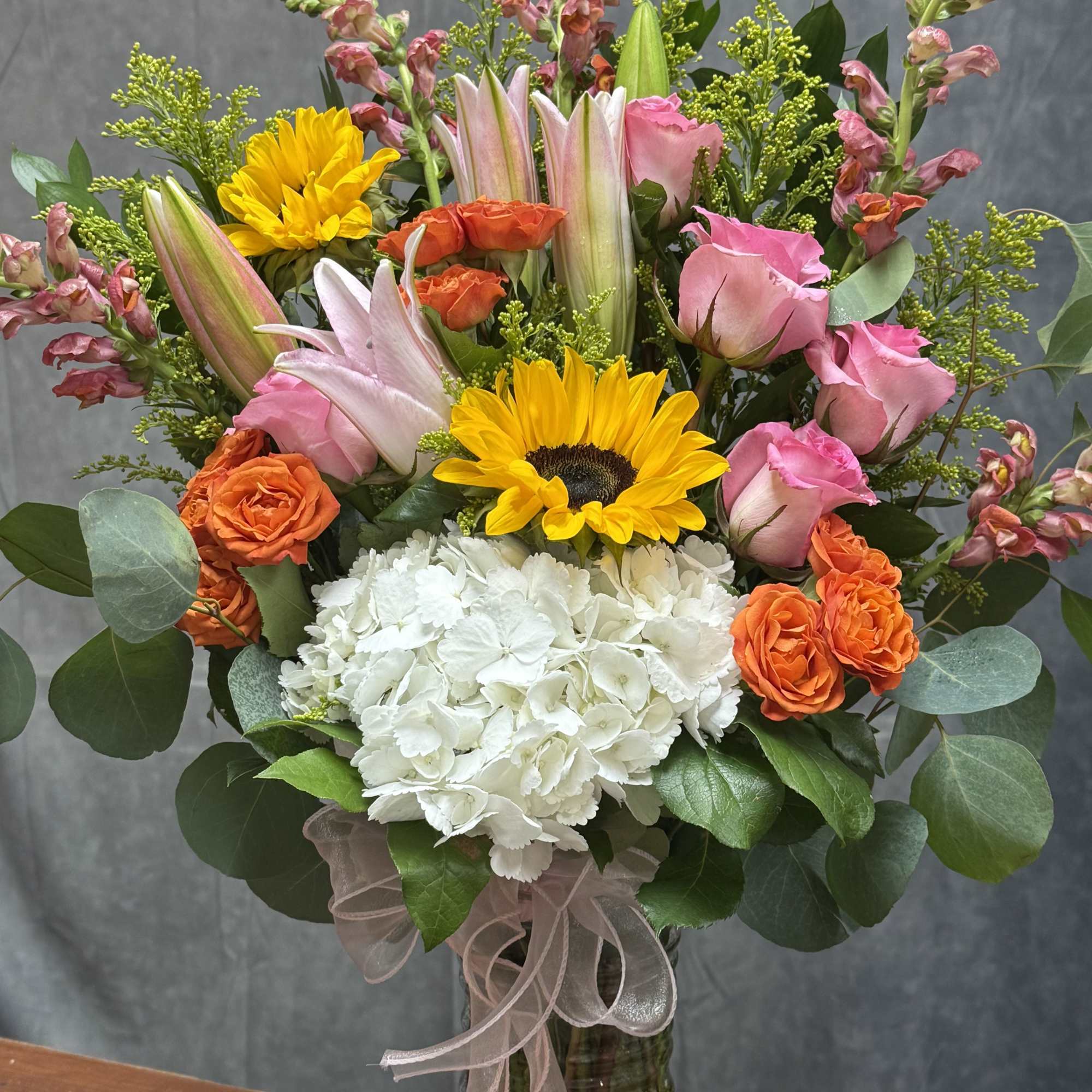 The Happy Garden vase greets the recipient with a cheerful mix of