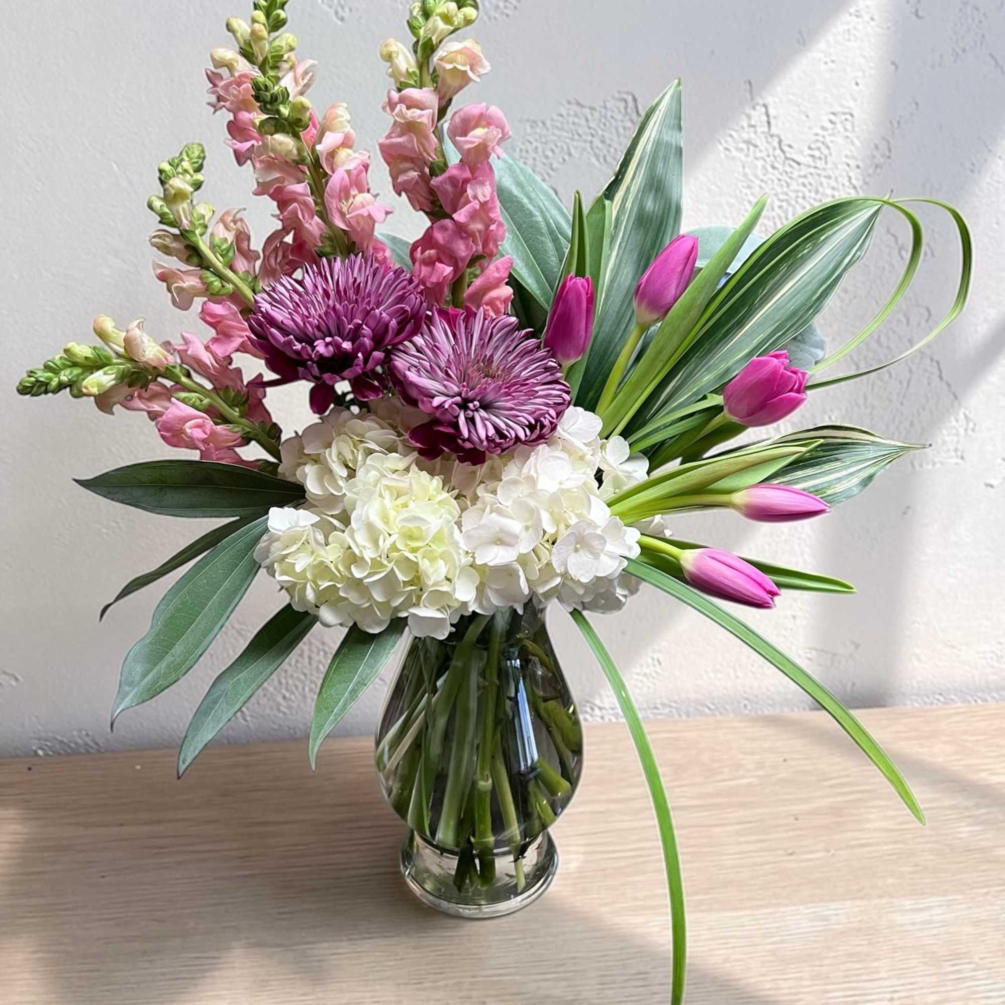 The Layla is a soft yet striking design featuring lush white hydrangeas