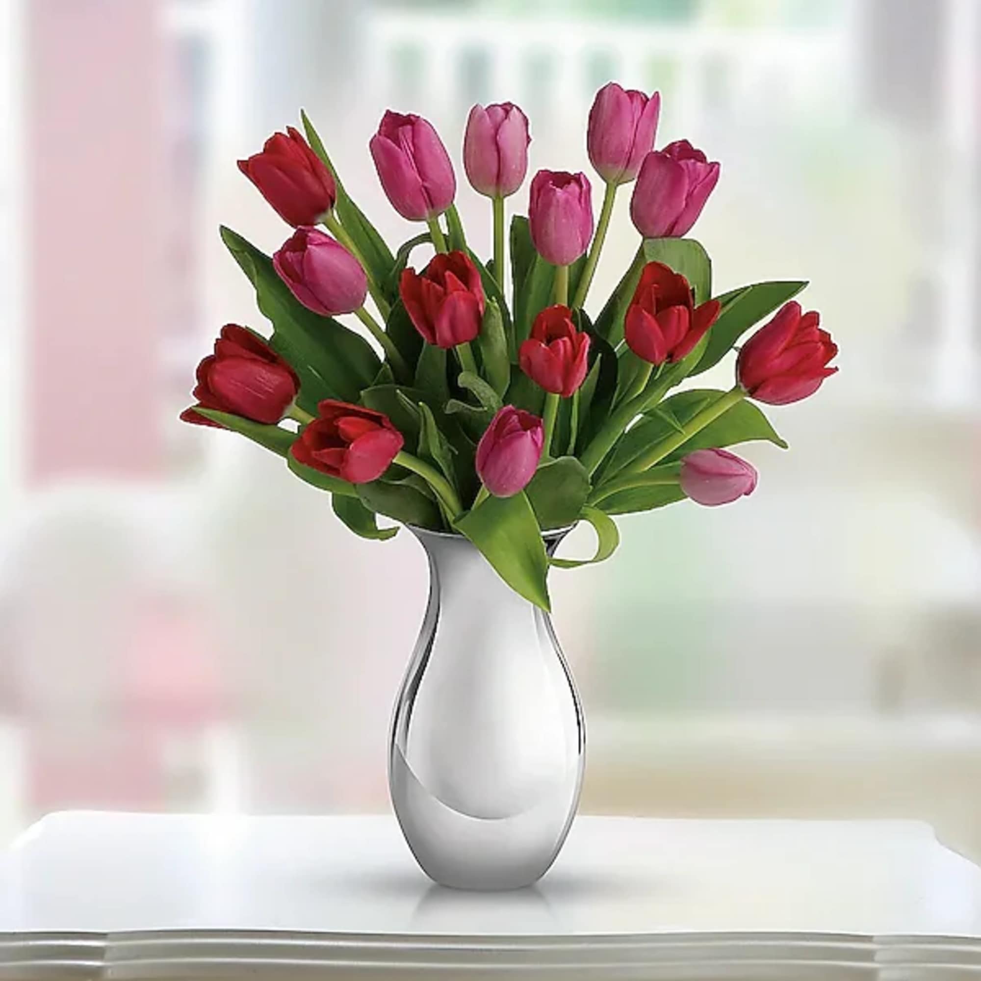 Surrender to the elegant, natural beauty of tulips. Over a dozen red