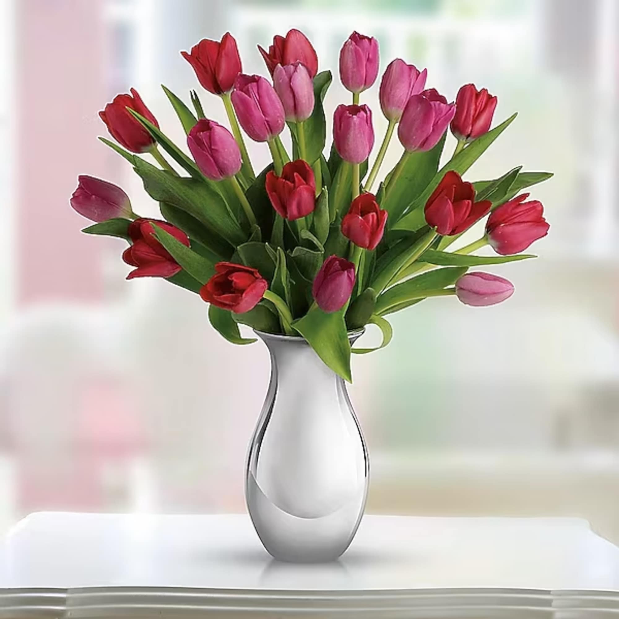 Surrender to the elegant, natural beauty of tulips. Over a dozen red