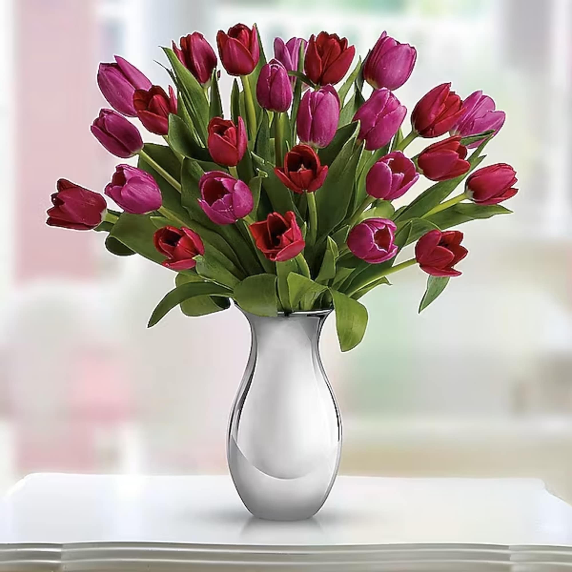 Surrender to the elegant, natural beauty of tulips. Over a dozen red