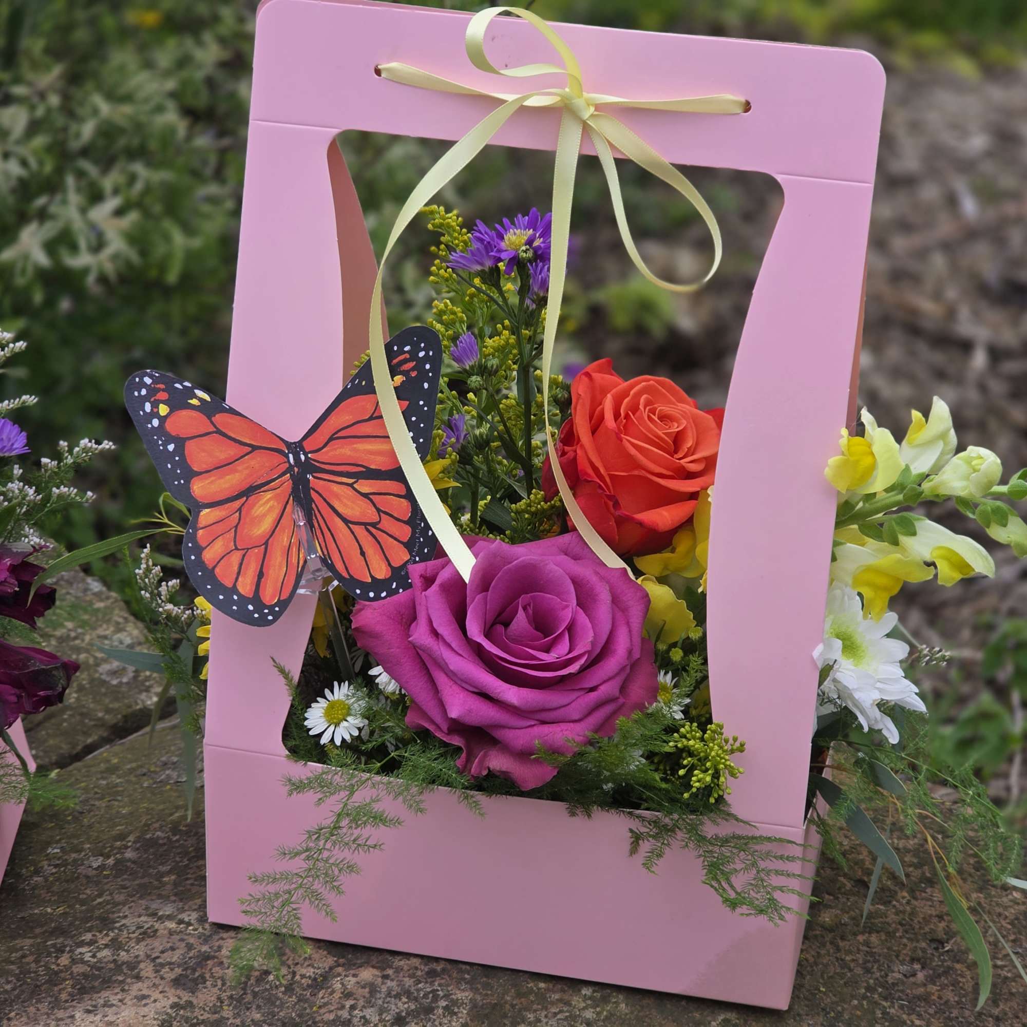 Beautiful, fresh-cut flowers designed in a handled carrier for easy transport. We&rsquo;ve