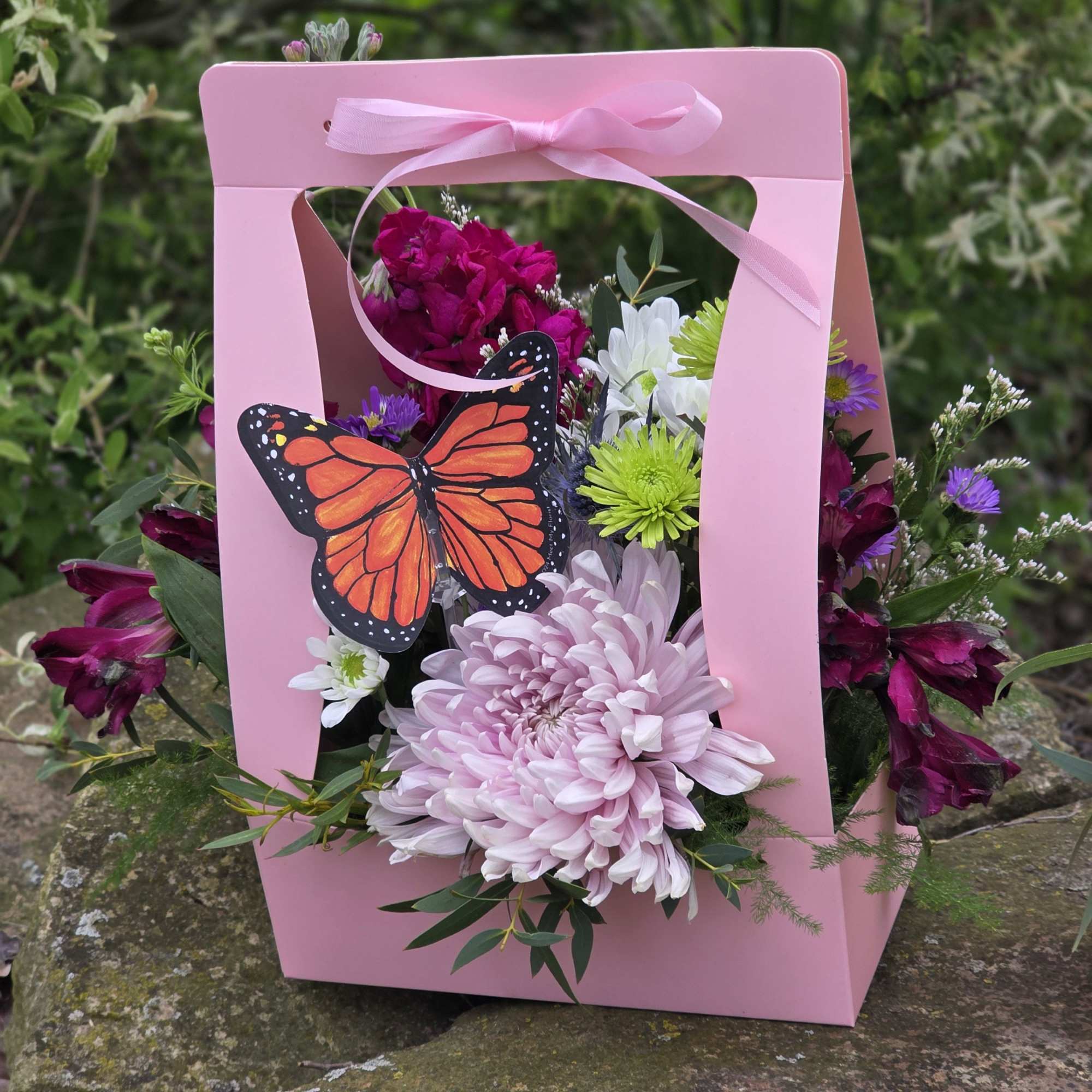 Beautiful, fresh-cut flowers designed in a handled carrier for easy transport. We&rsquo;ve