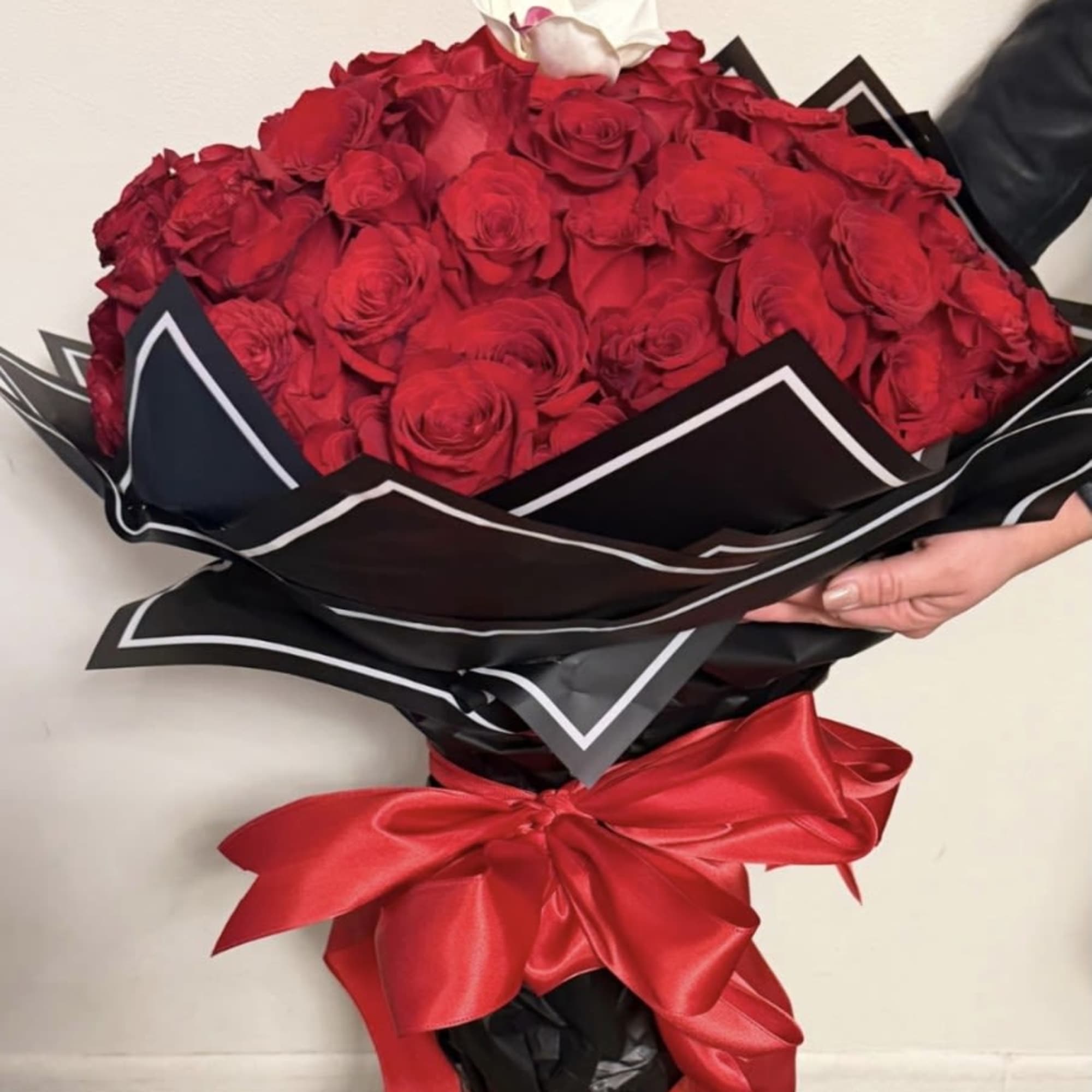 A Ramo Buchon or Russian-style bouquet of 72 stems of  roses