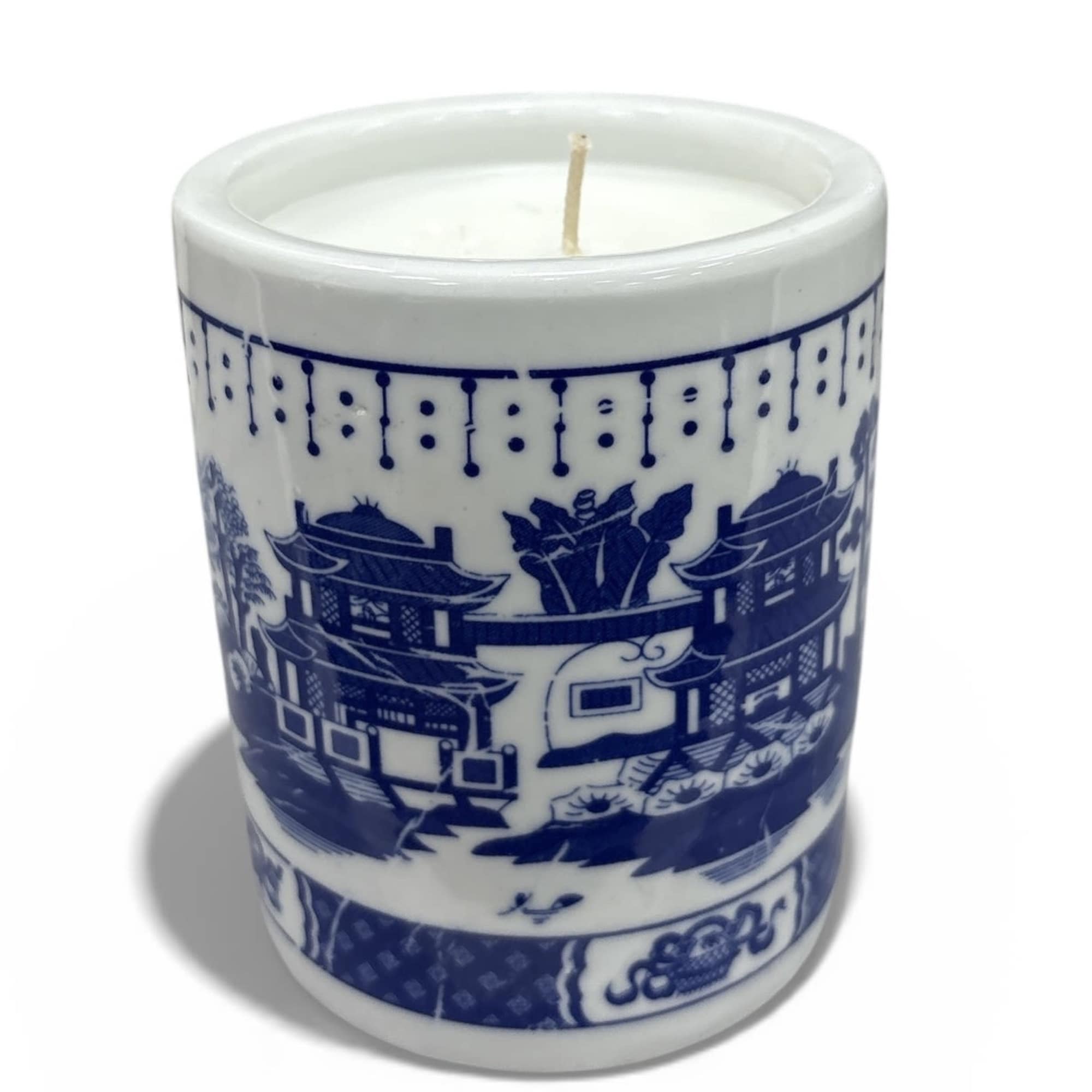 Blue-and-white ceramic candle with a single wick