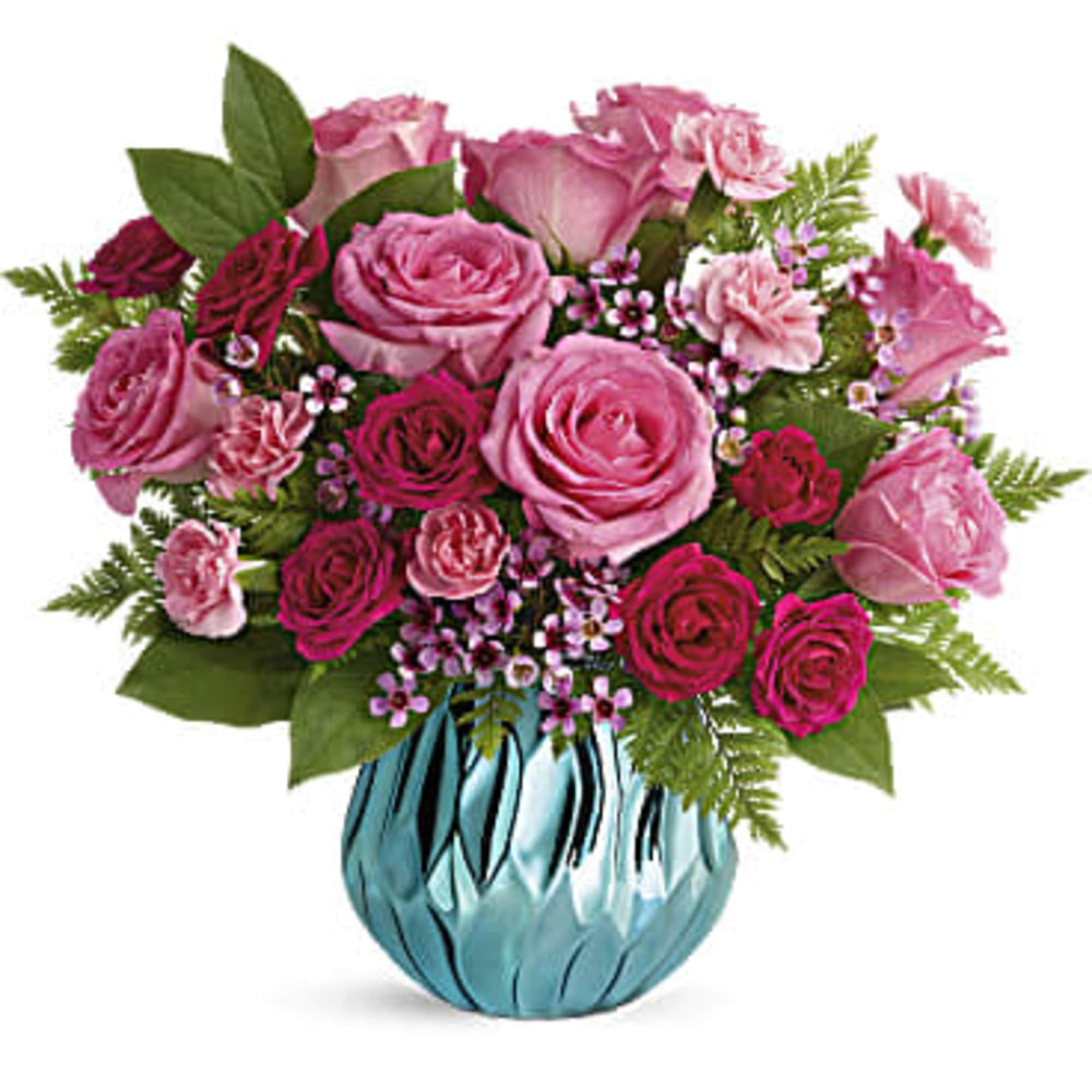 Pink rose bouquet in a blue glass vase