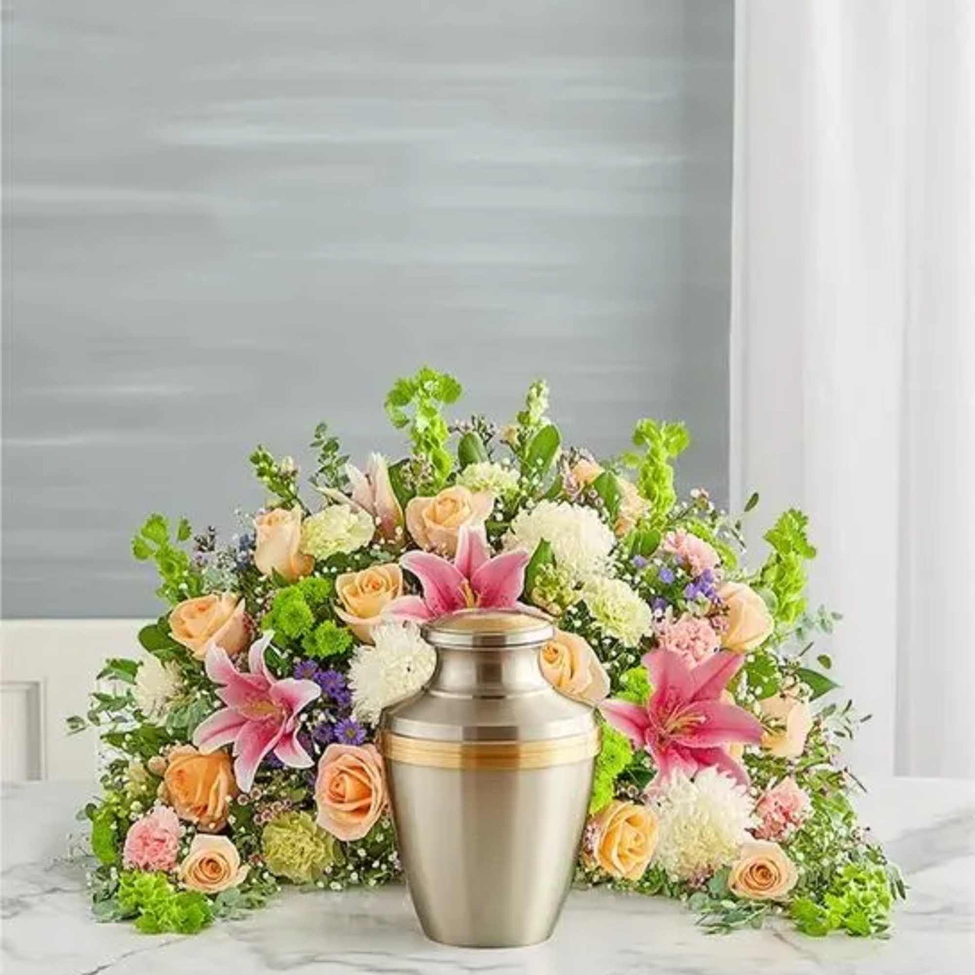 Express your heartfelt condolences with a beautiful floral tribute. Our crescent shaped