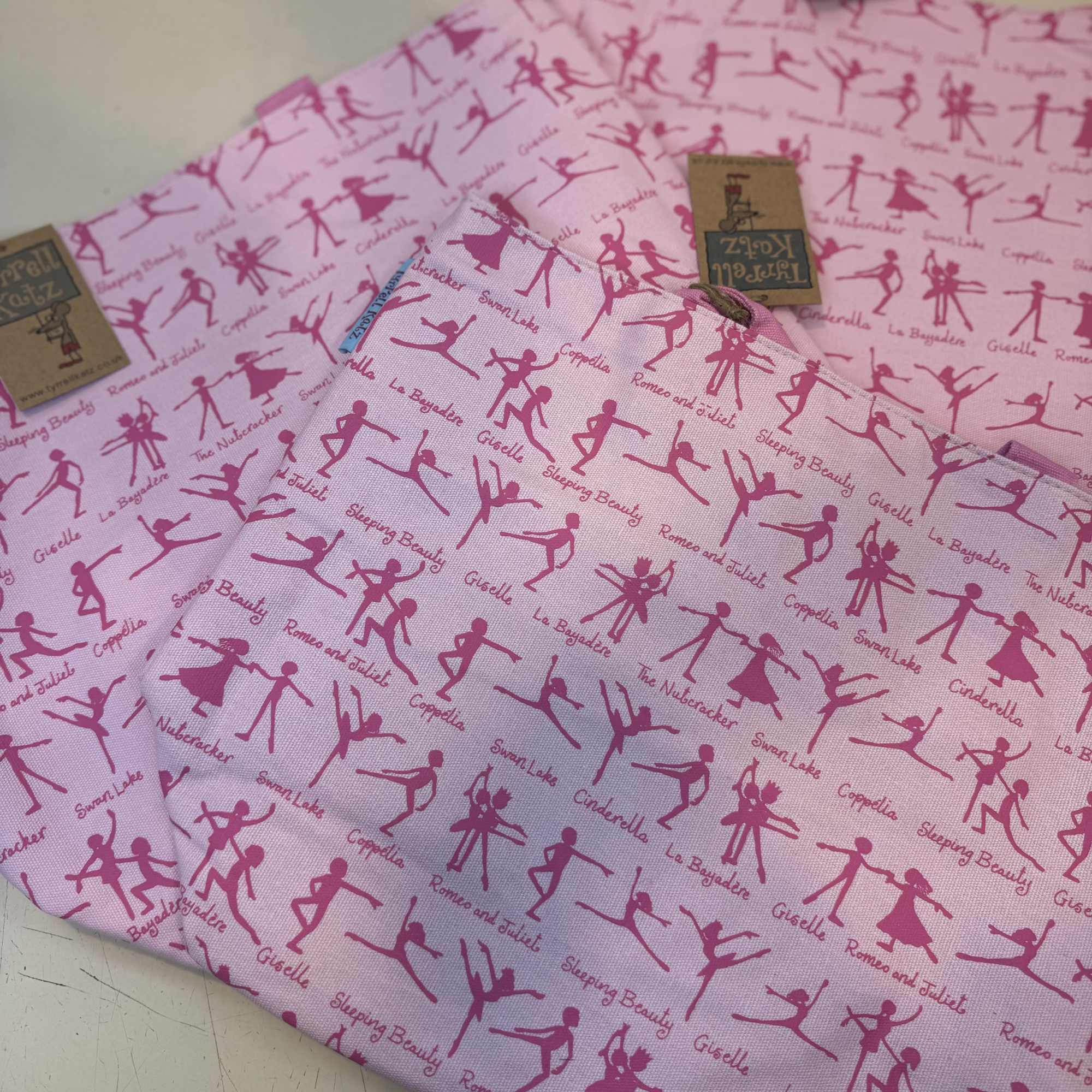 Charming pink ballet tote featuring classic ballet silhouettes and iconic dance productions.