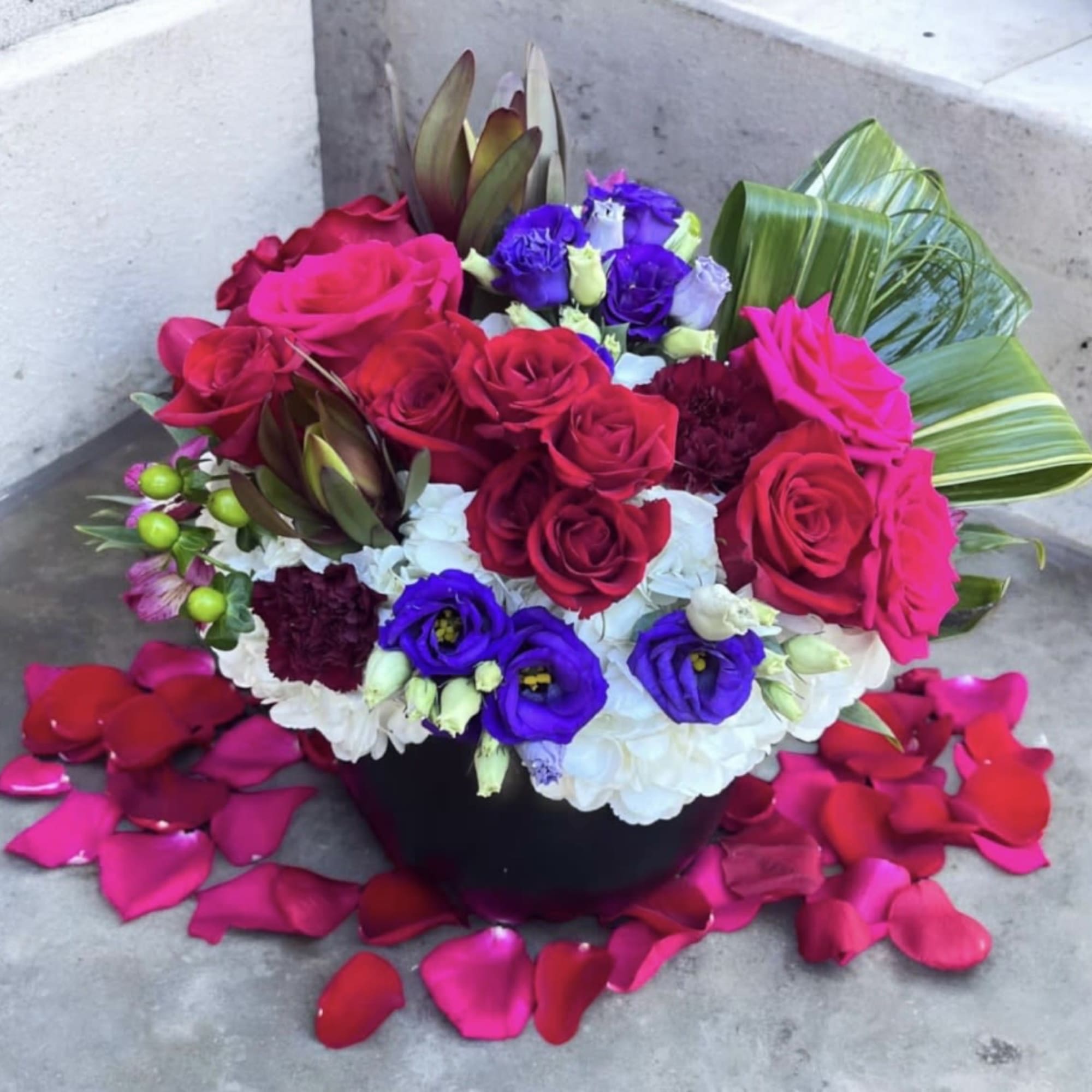 This beautifully designed arrangement is filled with hydrangea, roses, spray roses, Lisianthus