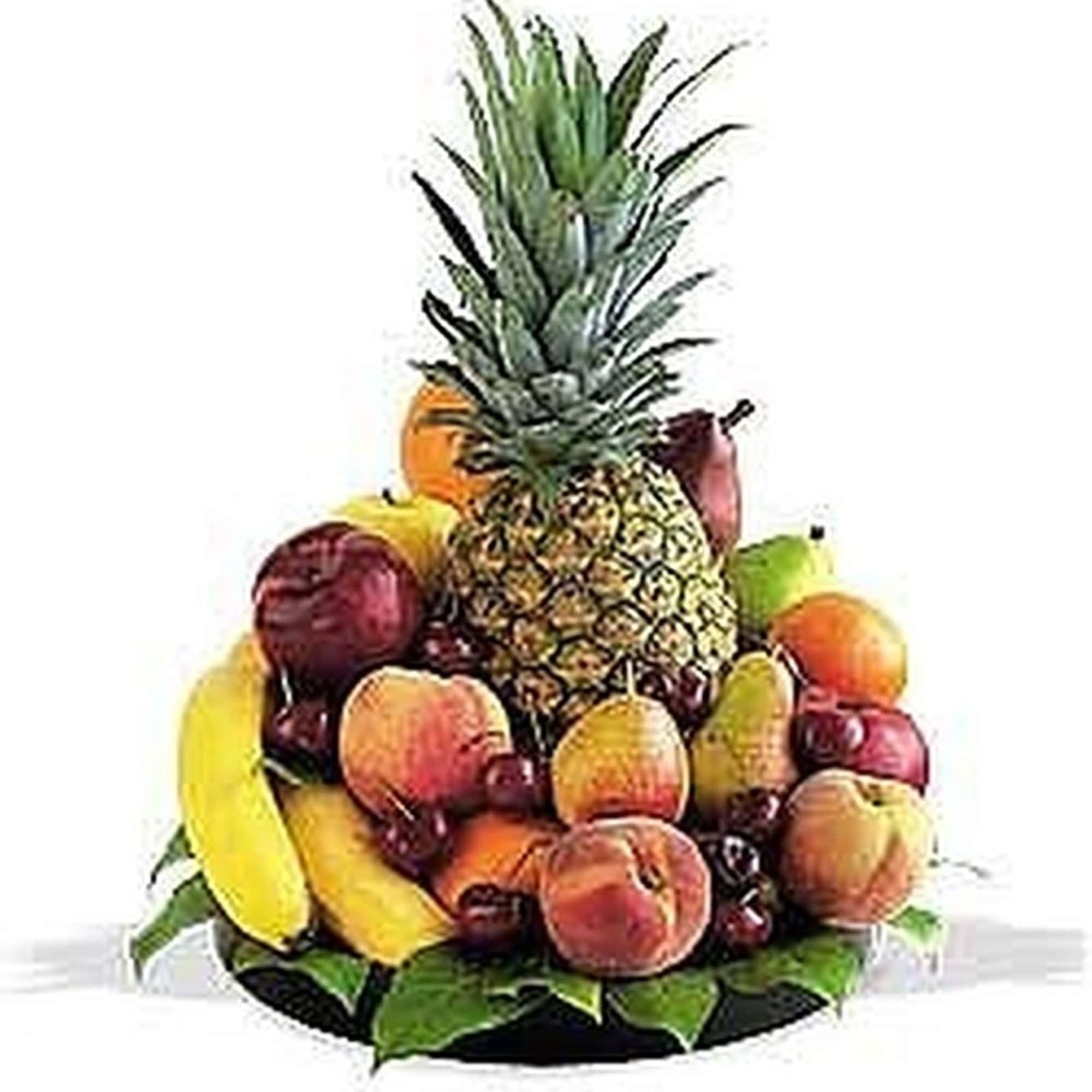 Assorted fresh fruits arranged around a tall pineapple on a platter